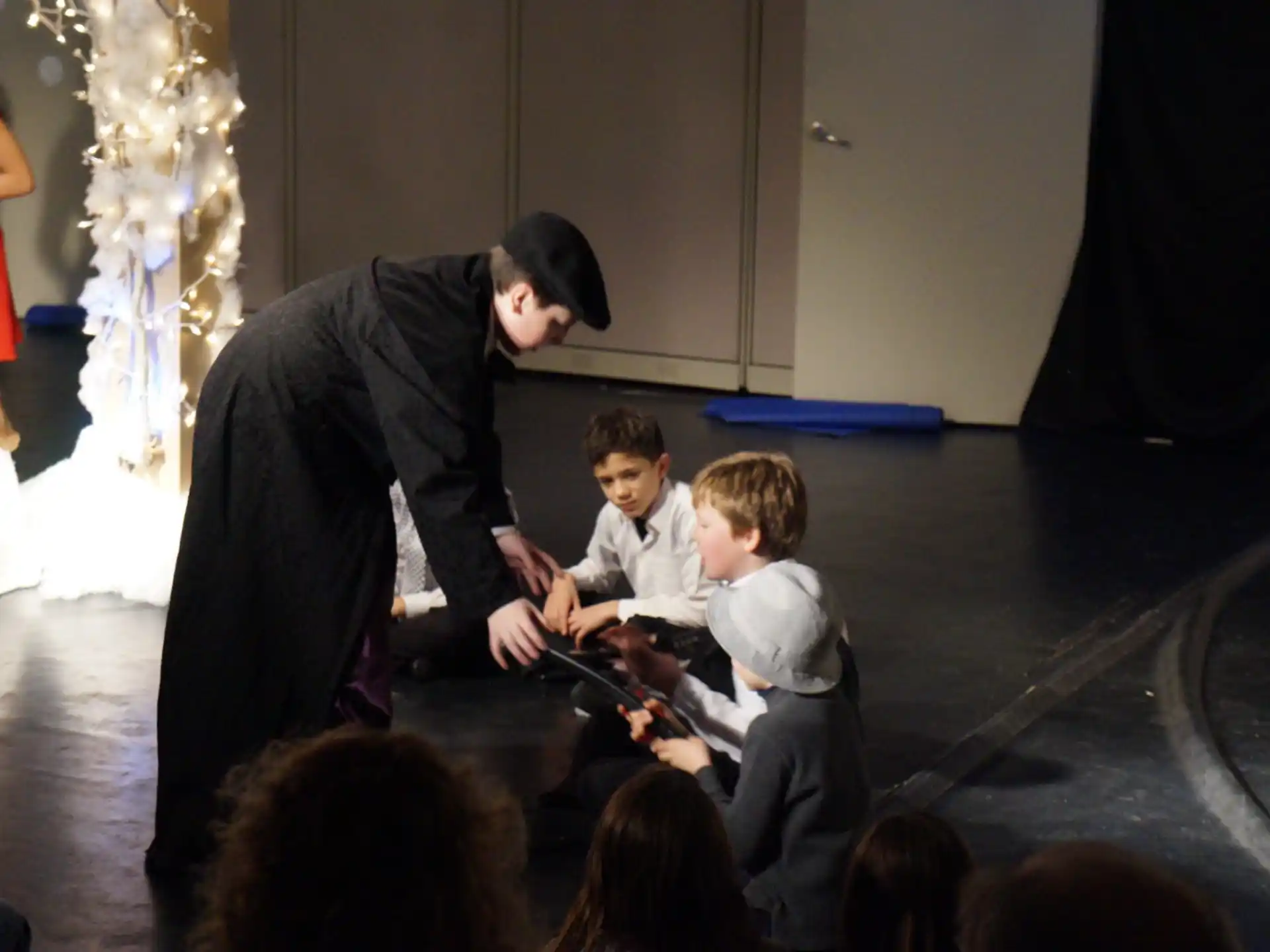 a person cutting a boy's hair