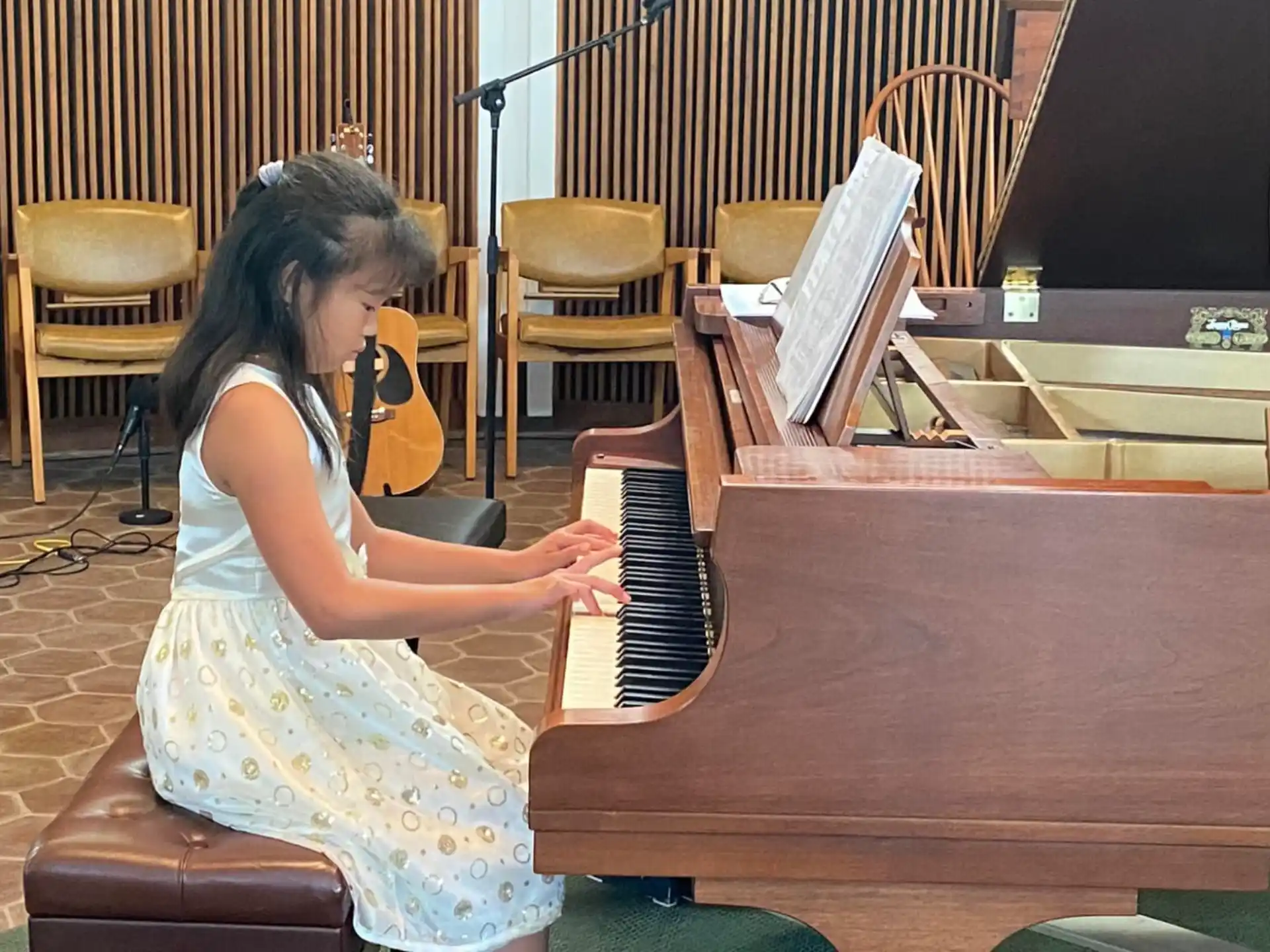 a woman playing a piano