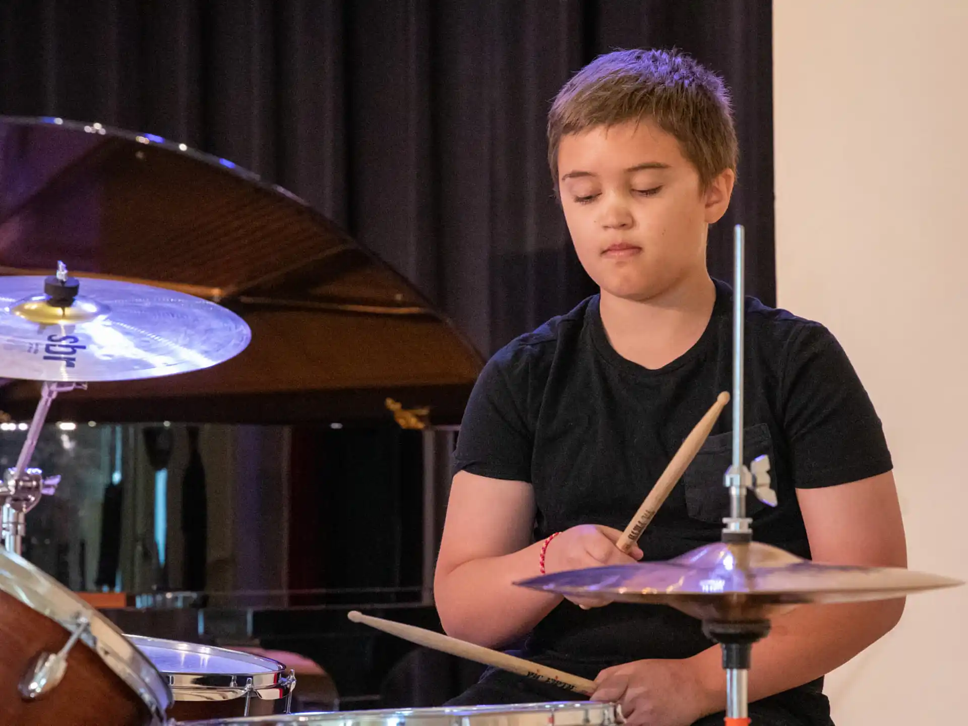 a boy playing drums