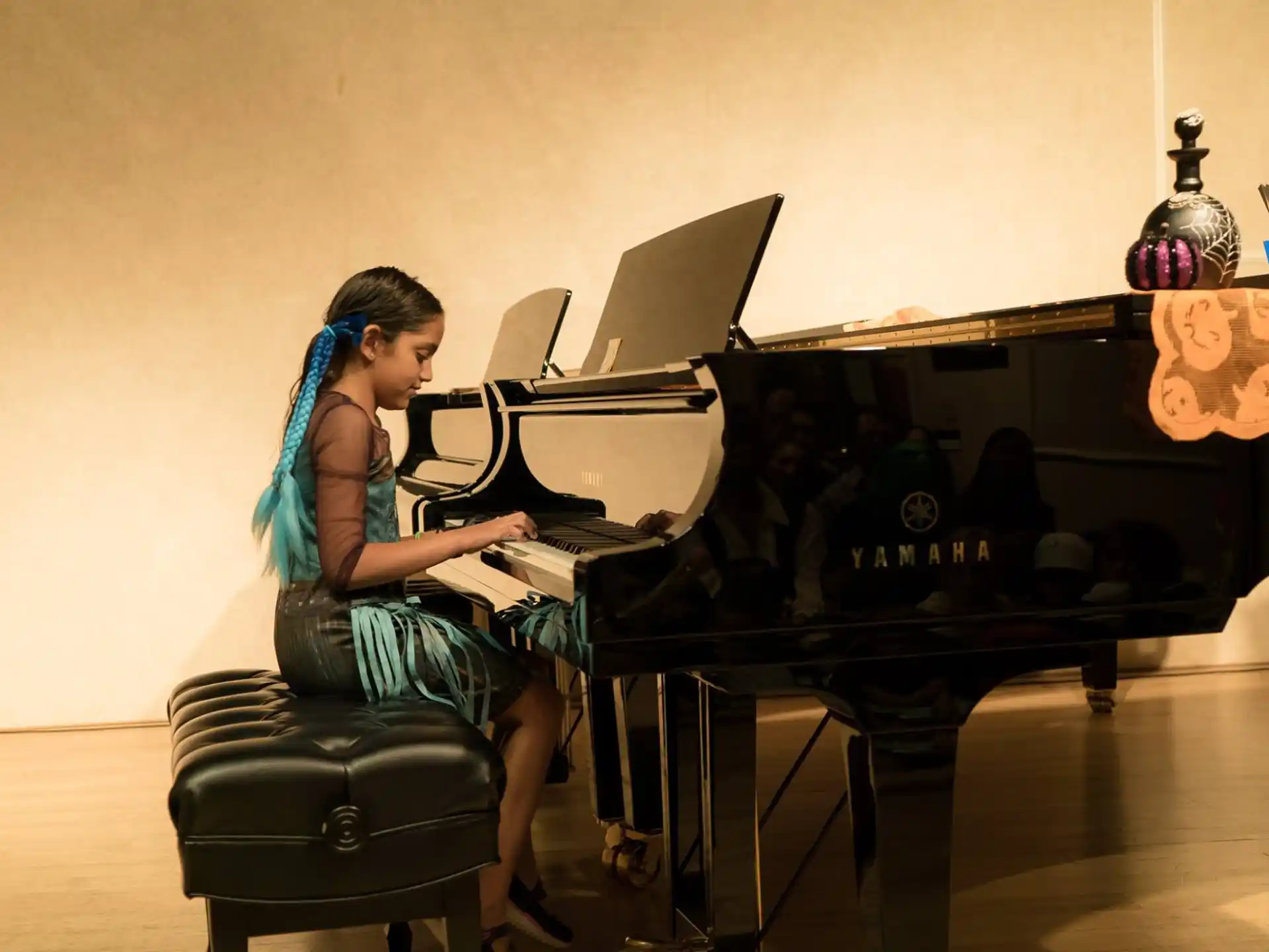 a woman playing the piano