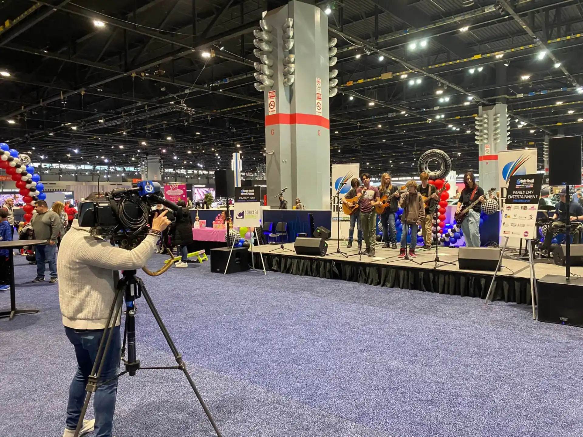 a person filming a group of people