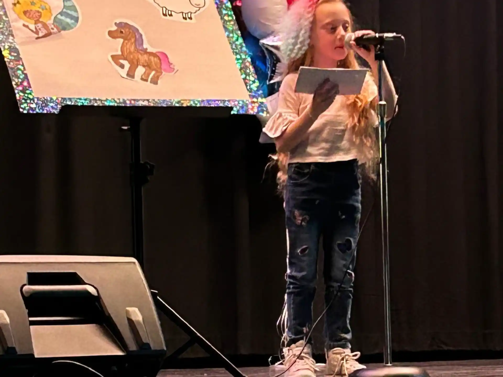 a person singing on a stage