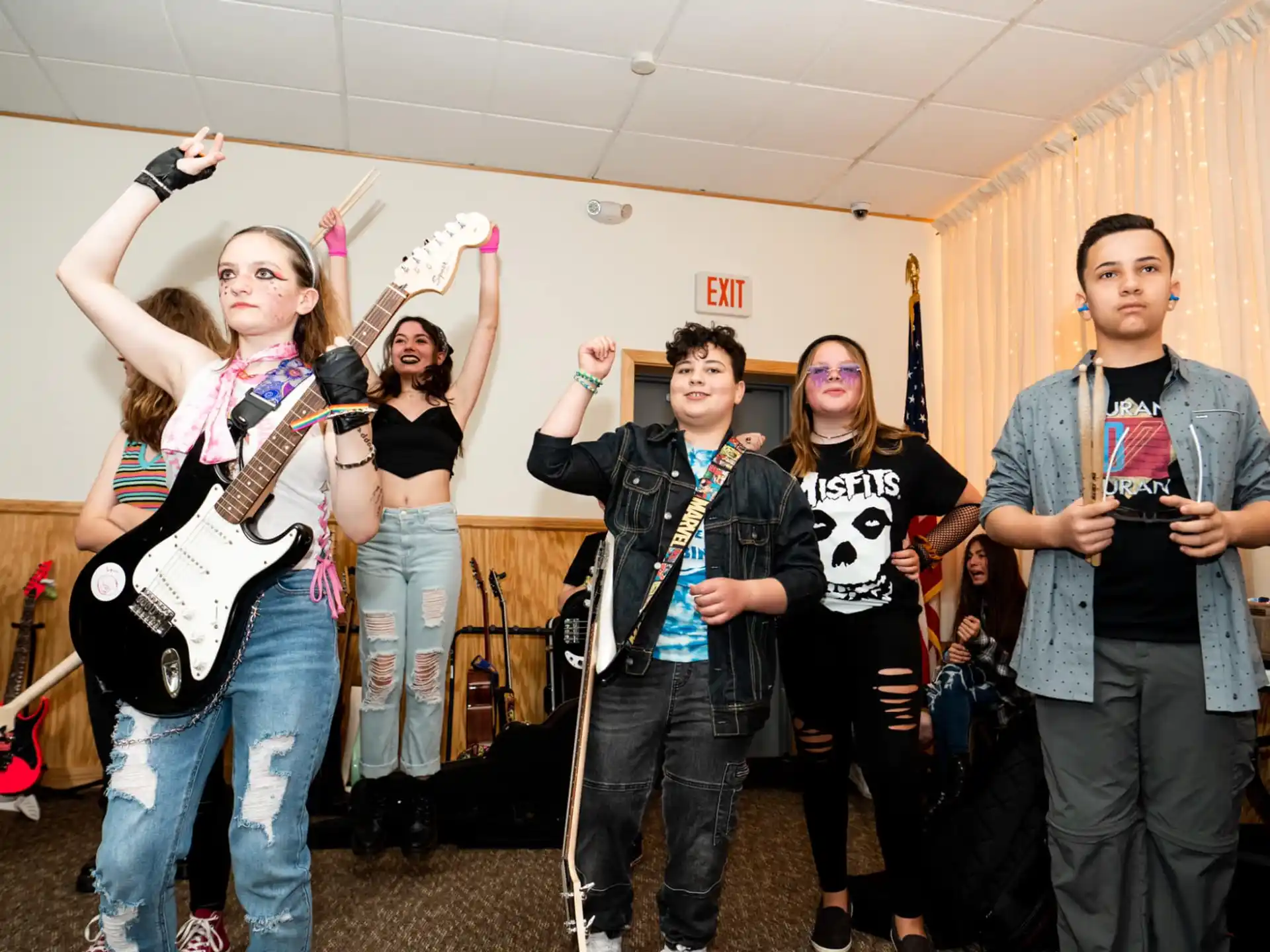 a group of people holding instruments