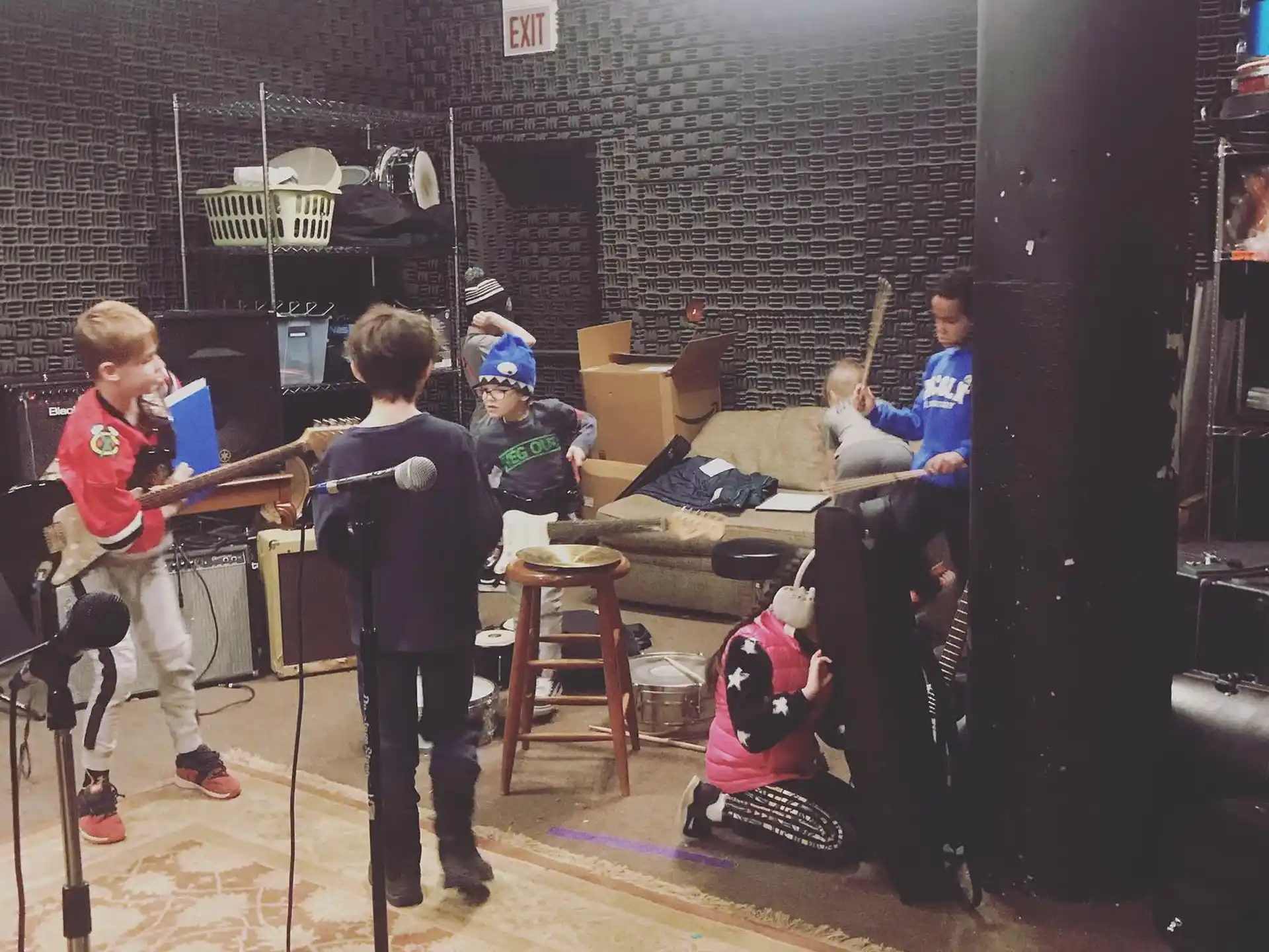 a group of kids playing instruments