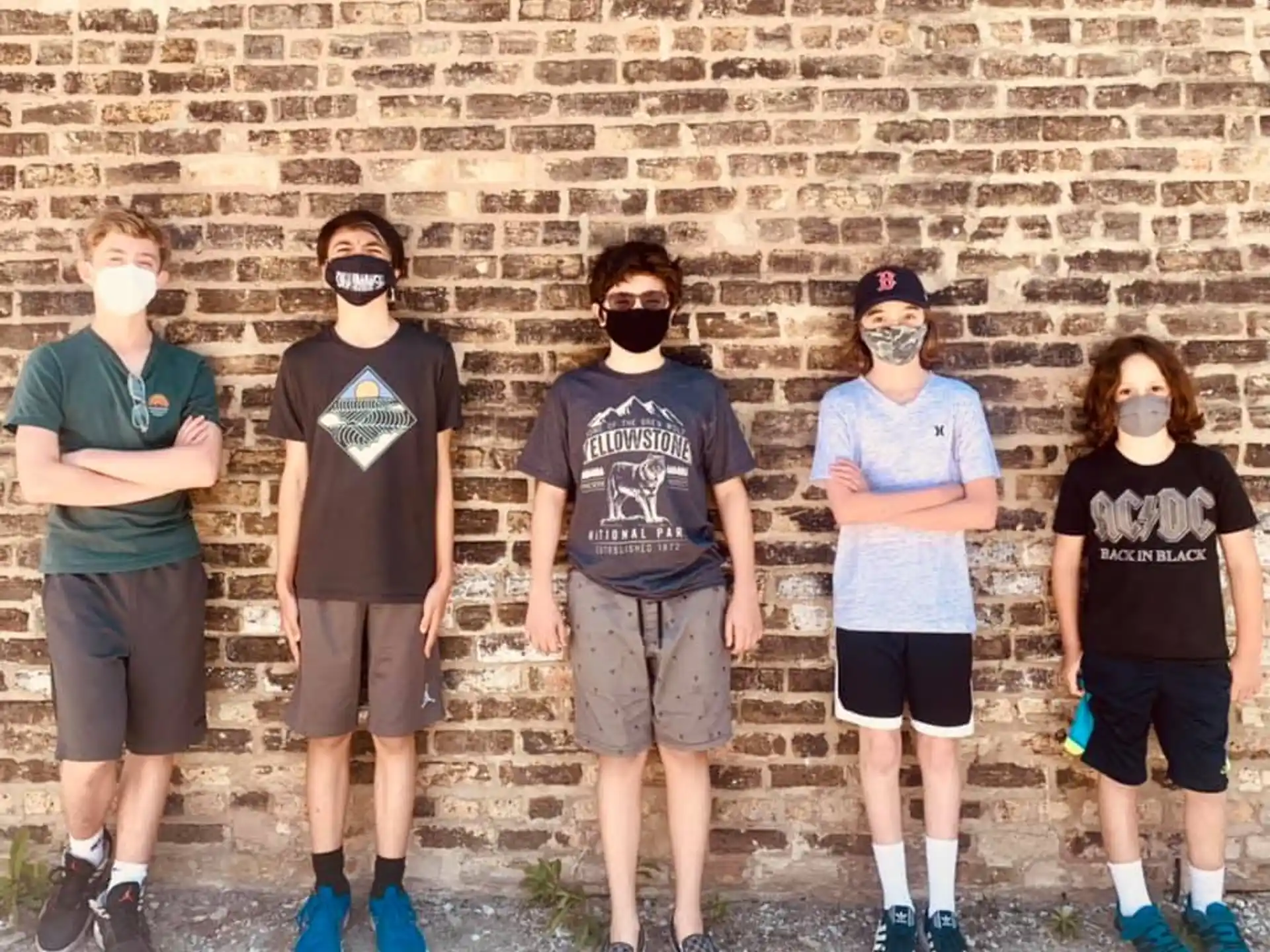 a group of people wearing masks