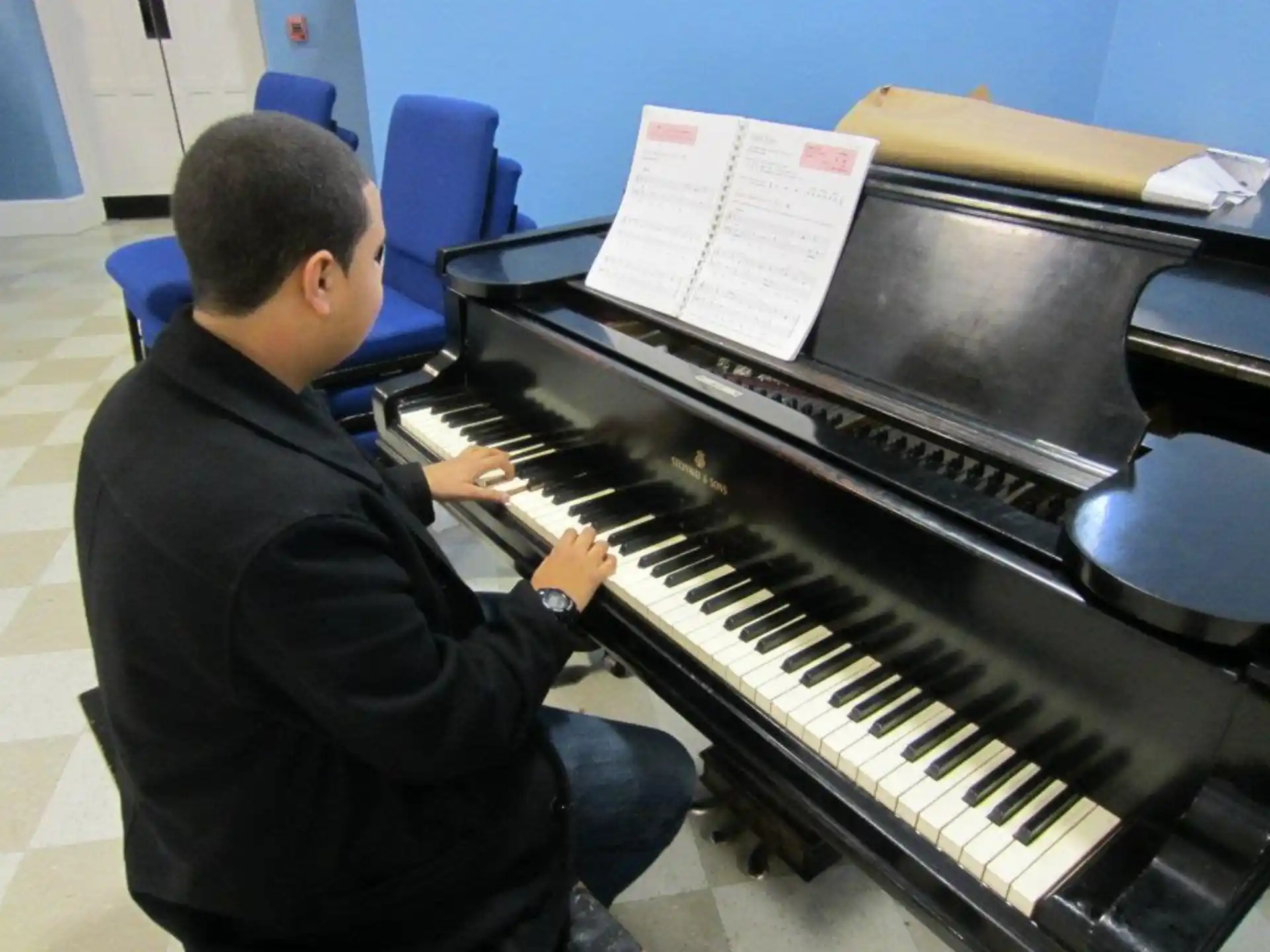 a man playing a piano
