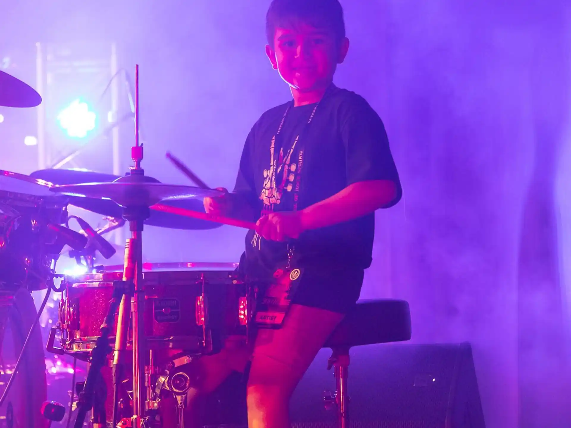 a boy playing the drums