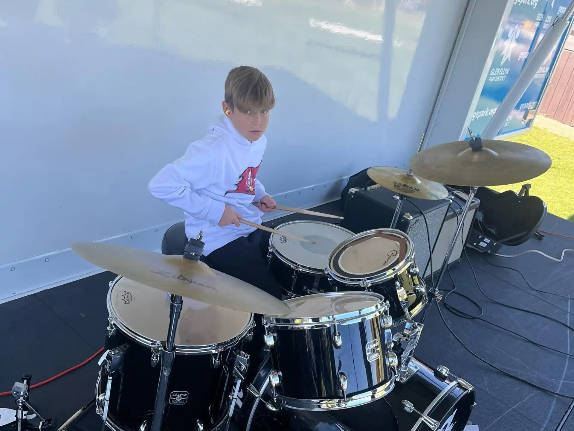 a boy playing the drums