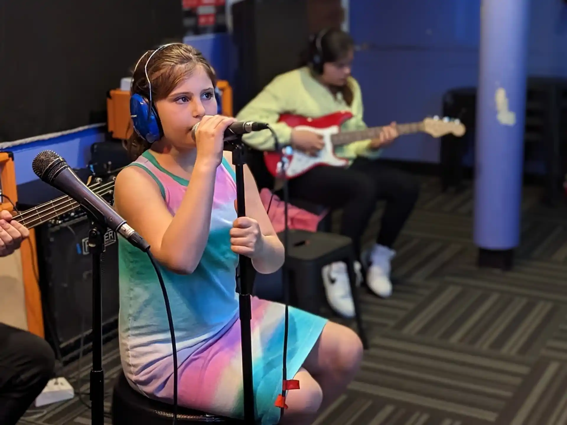 a person singing into a microphone