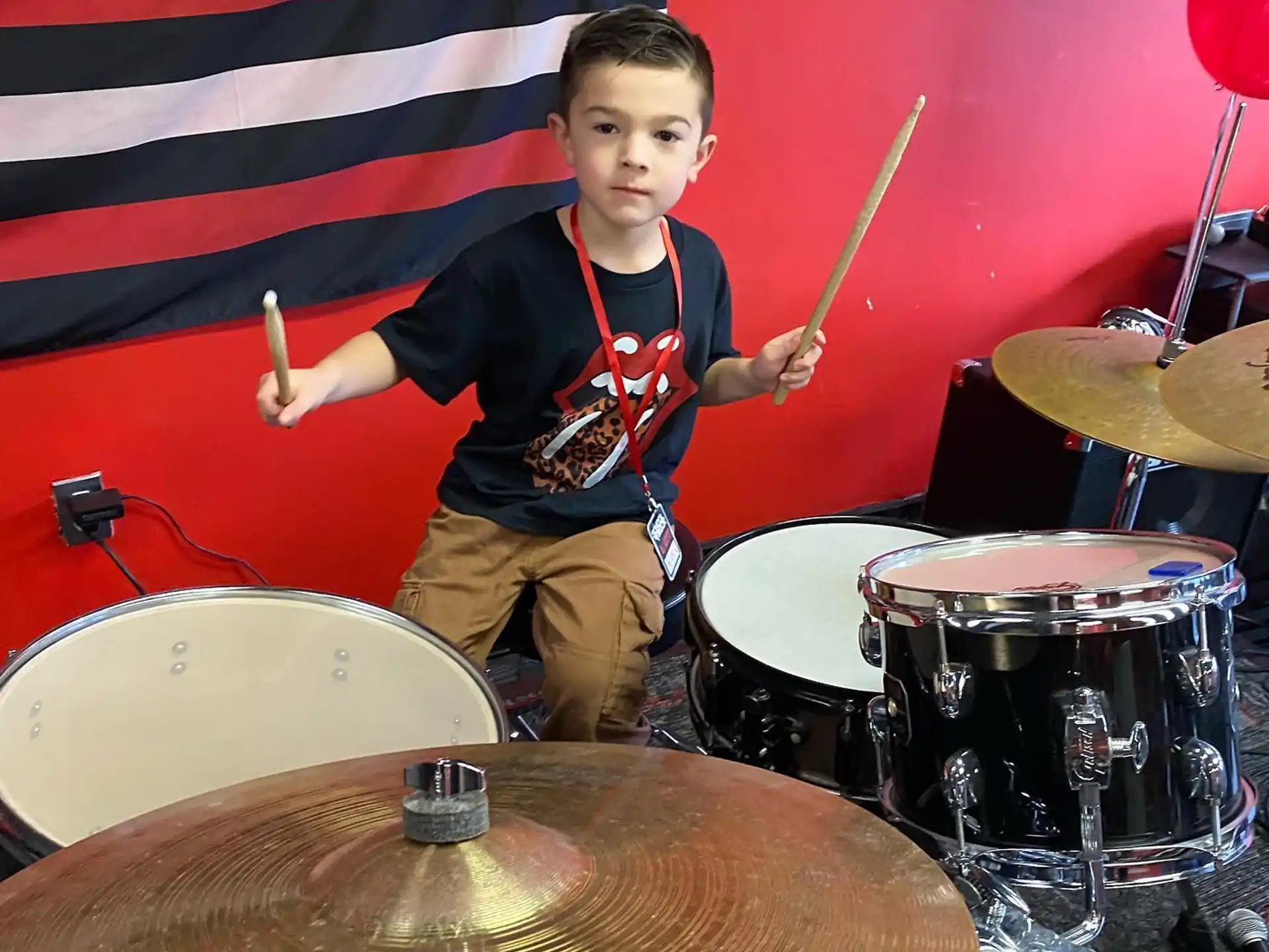 a boy playing drums