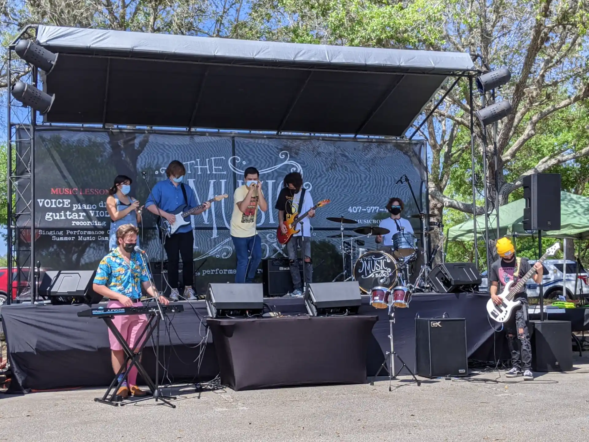 a group of people playing instruments on a stage