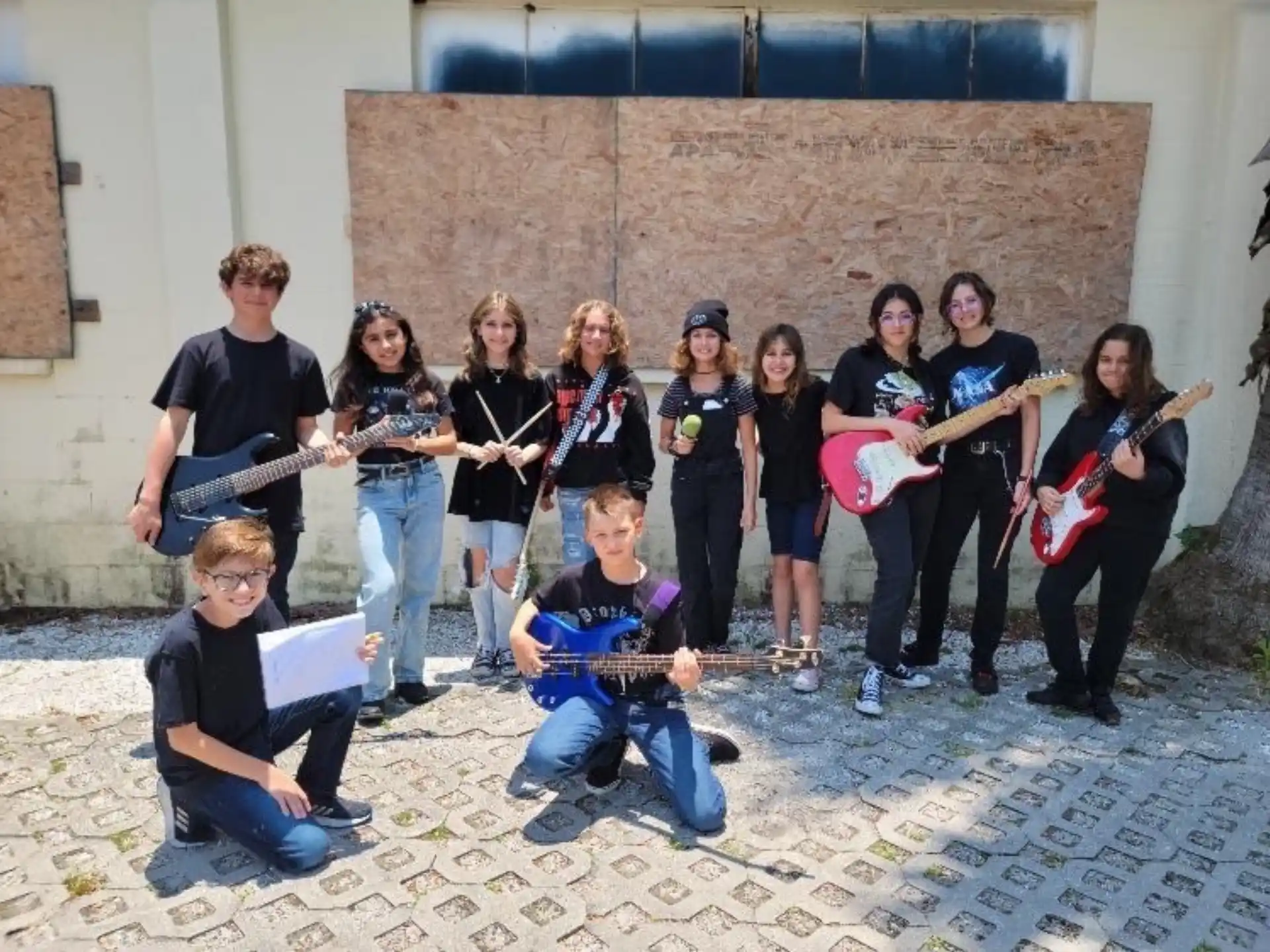 a group of people holding musical instruments
