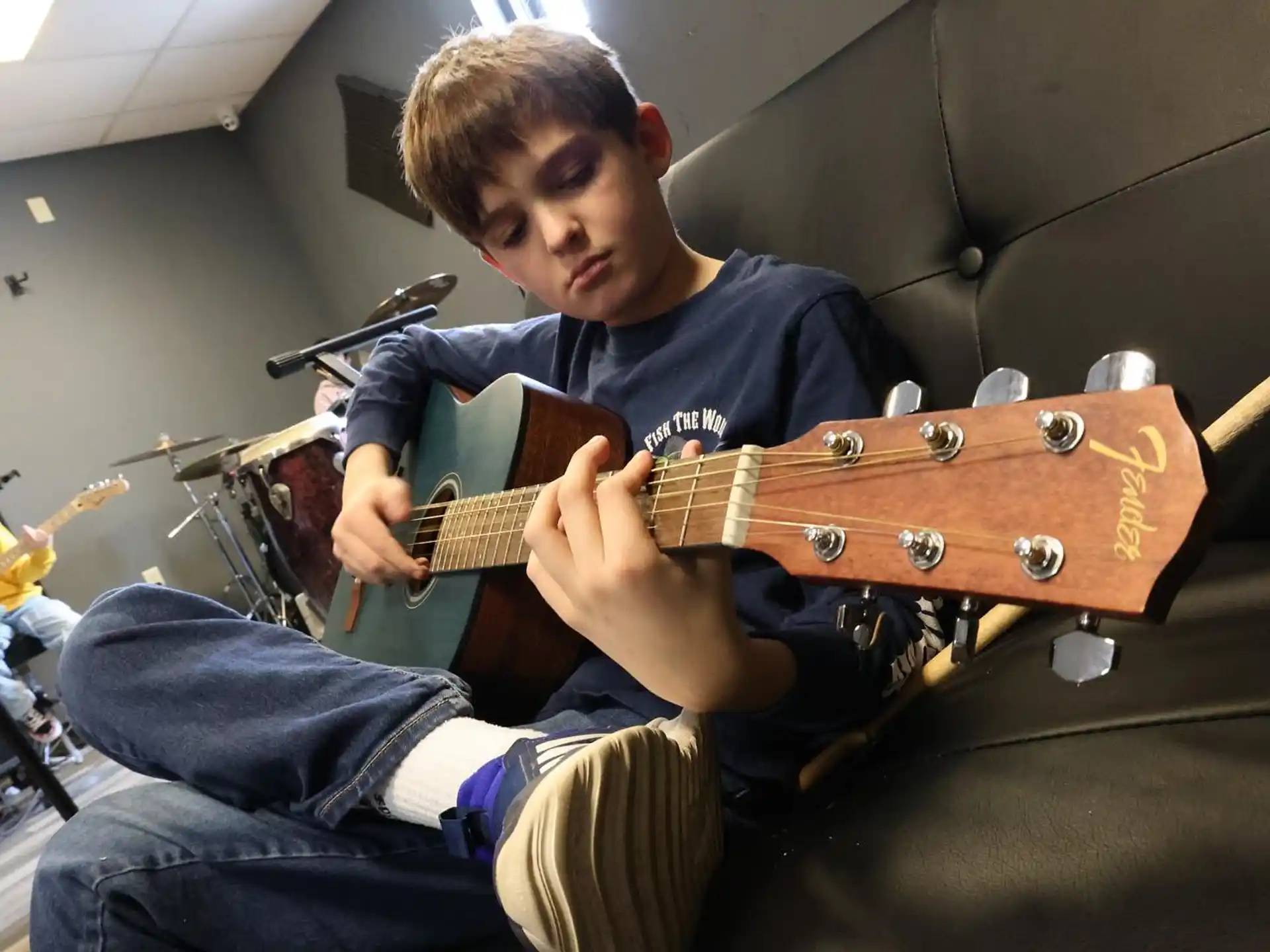 a person playing a guitar