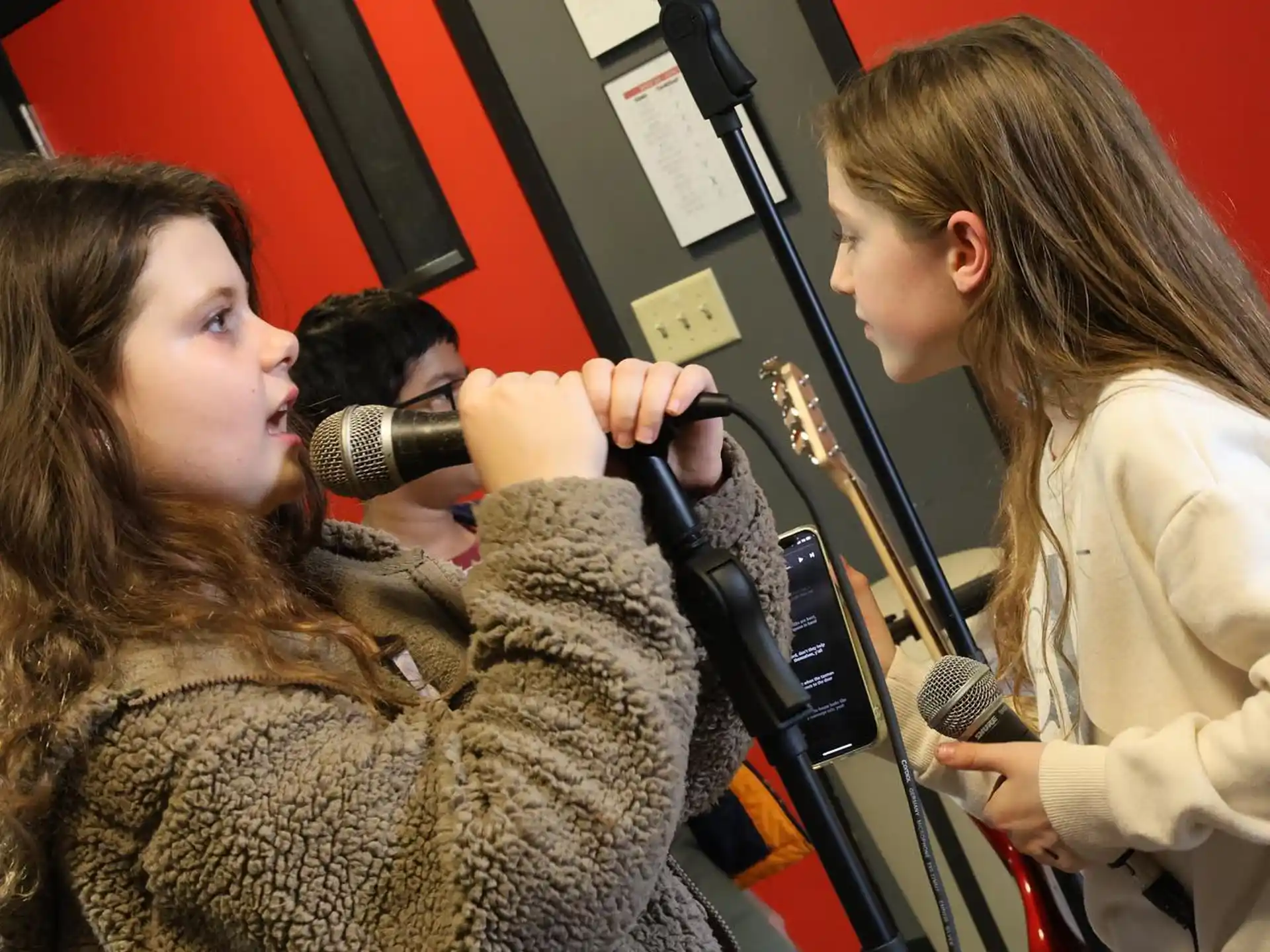 a woman speaking into a microphone