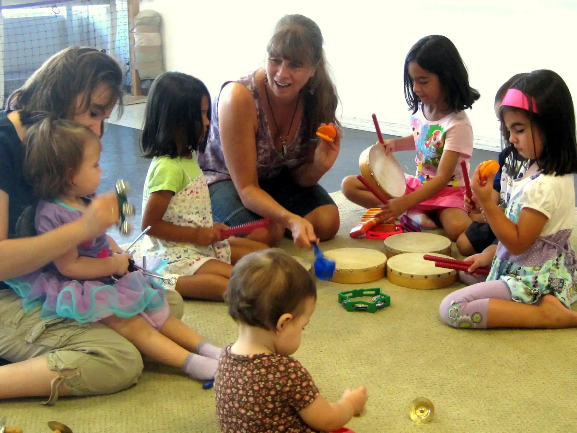 a group of children sitting on the floor