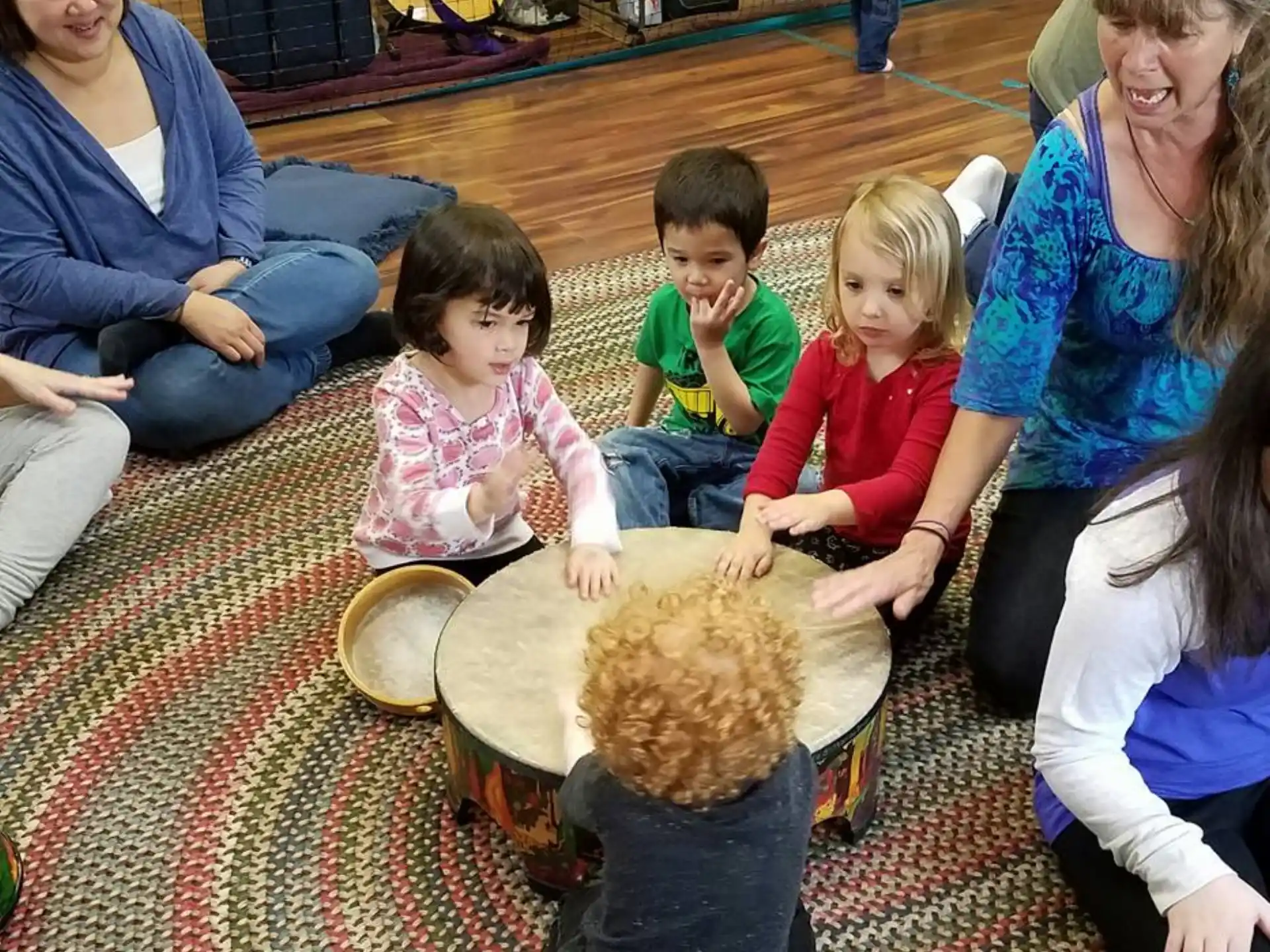 a group of people sitting on the floor