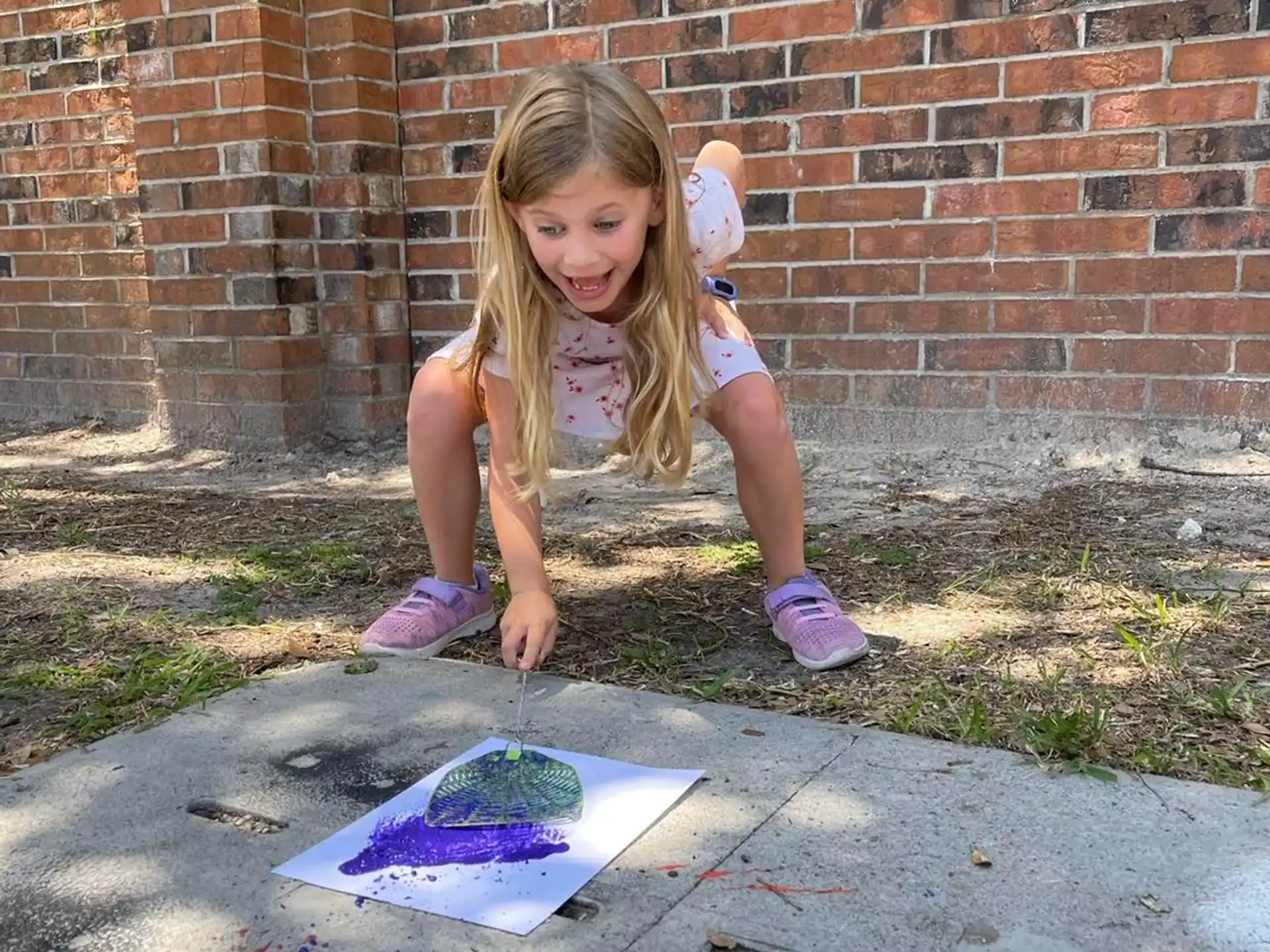 a girl kneeling on the ground