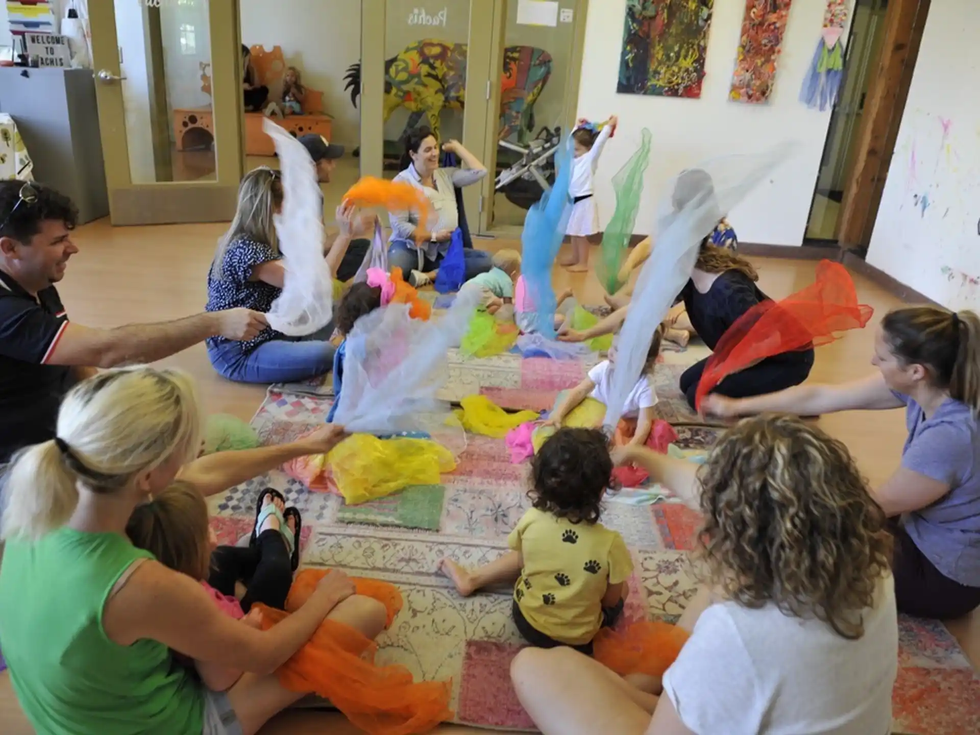 a group of people sitting on the floor
