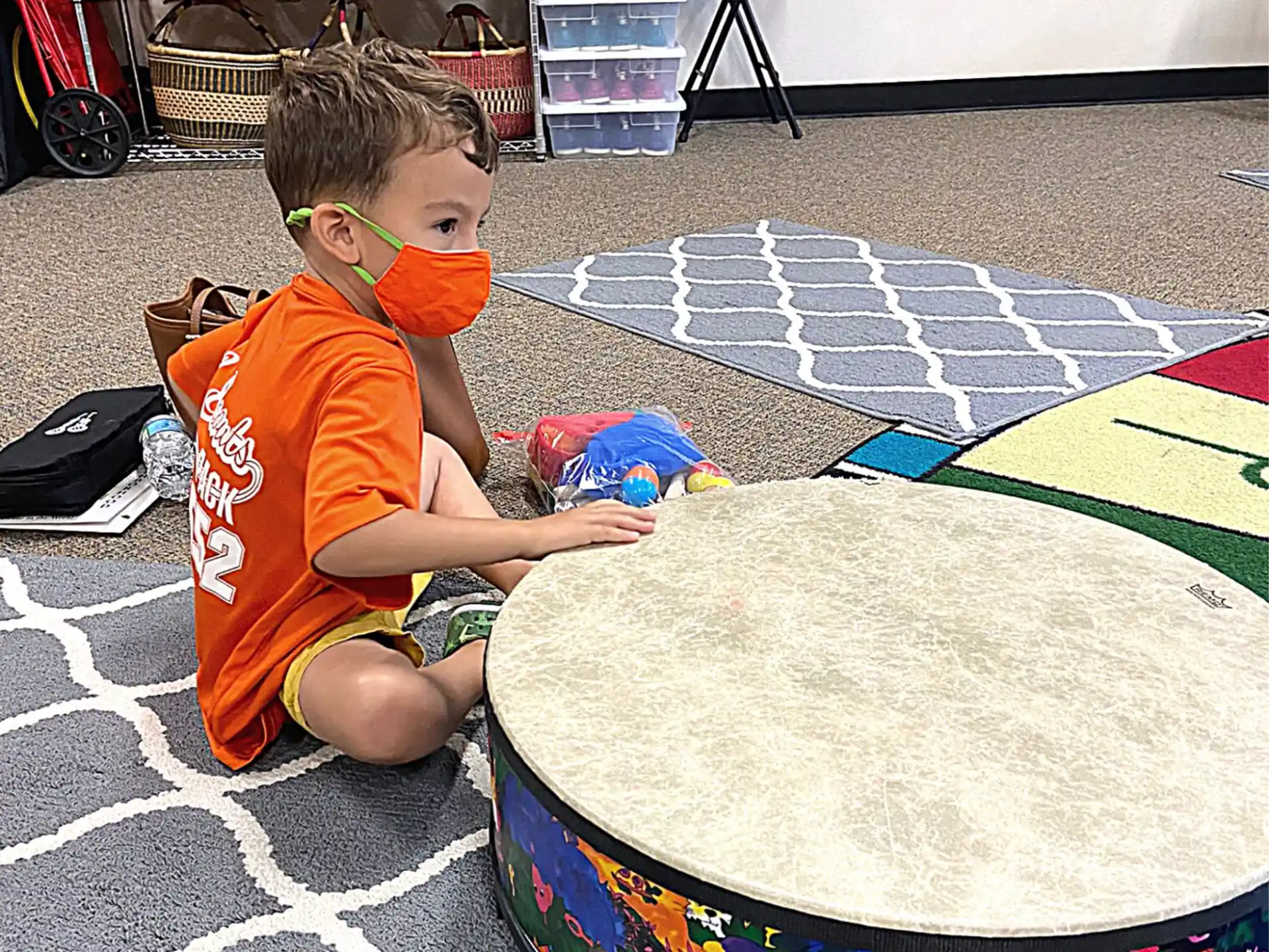 a boy playing with a toy