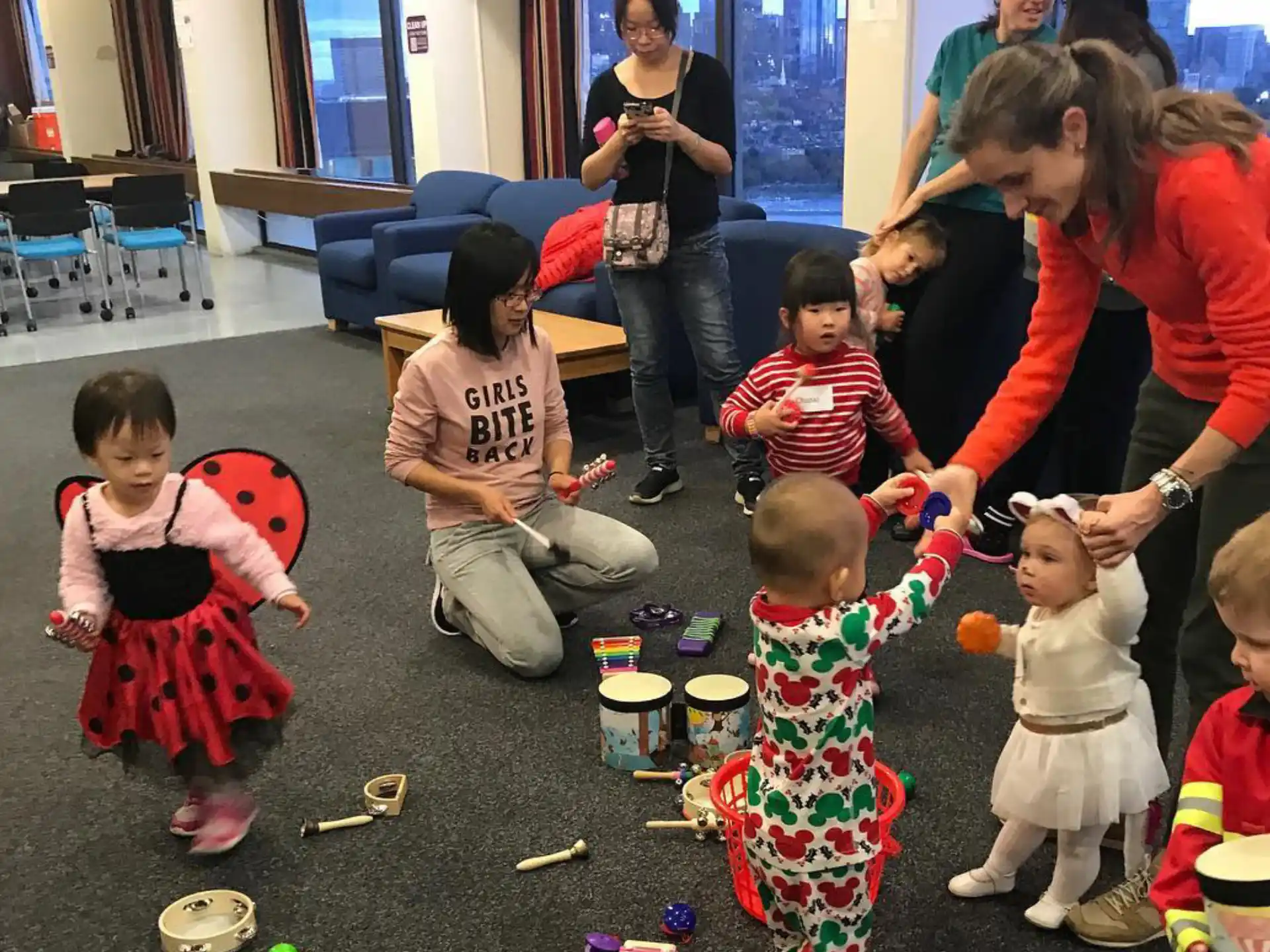 a group of people playing with toys