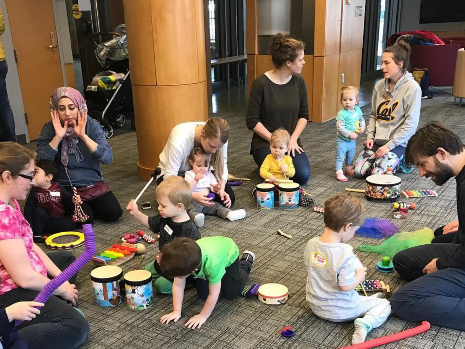 a group of people sitting on the floor eating