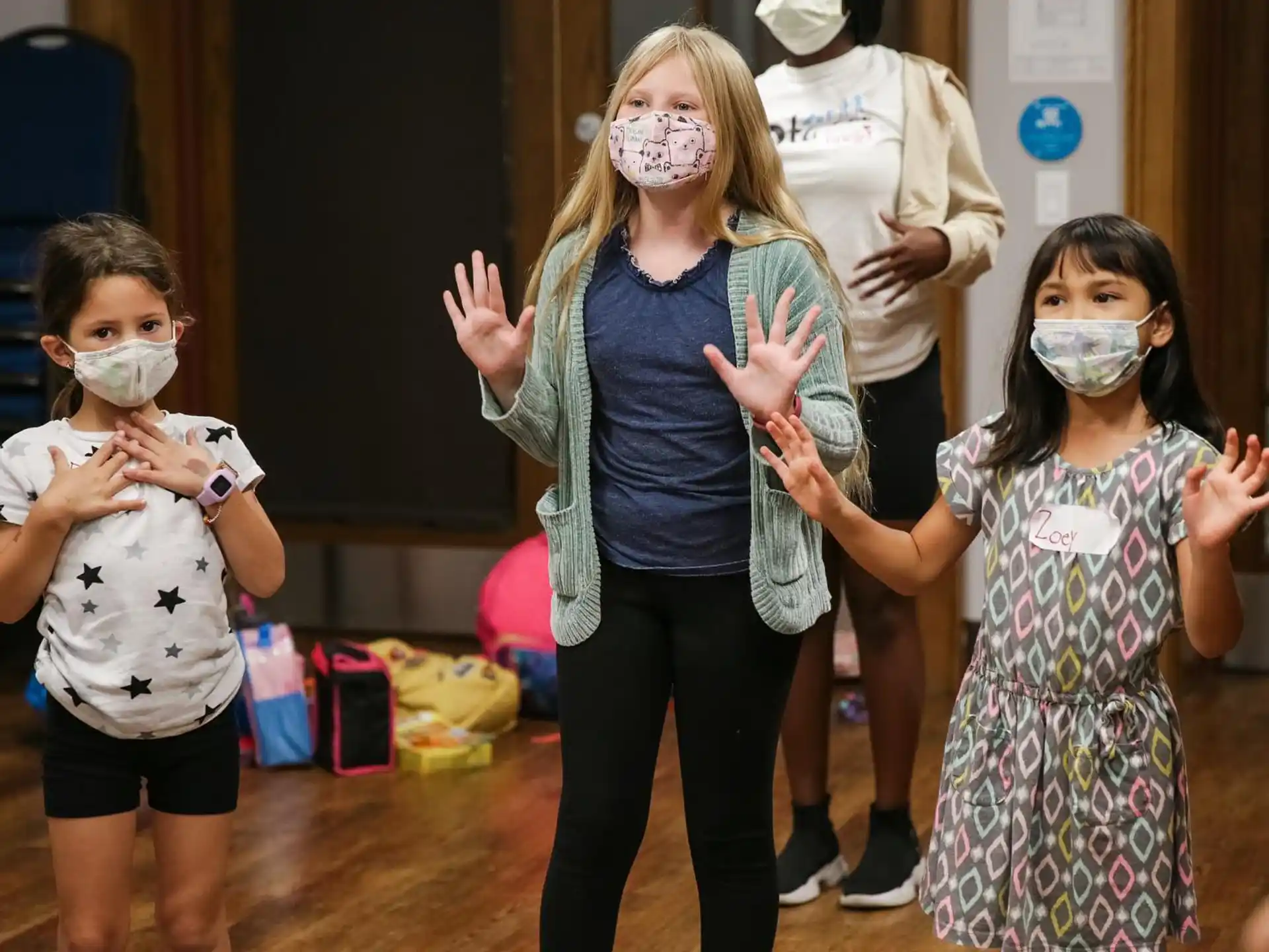 a group of people wearing masks