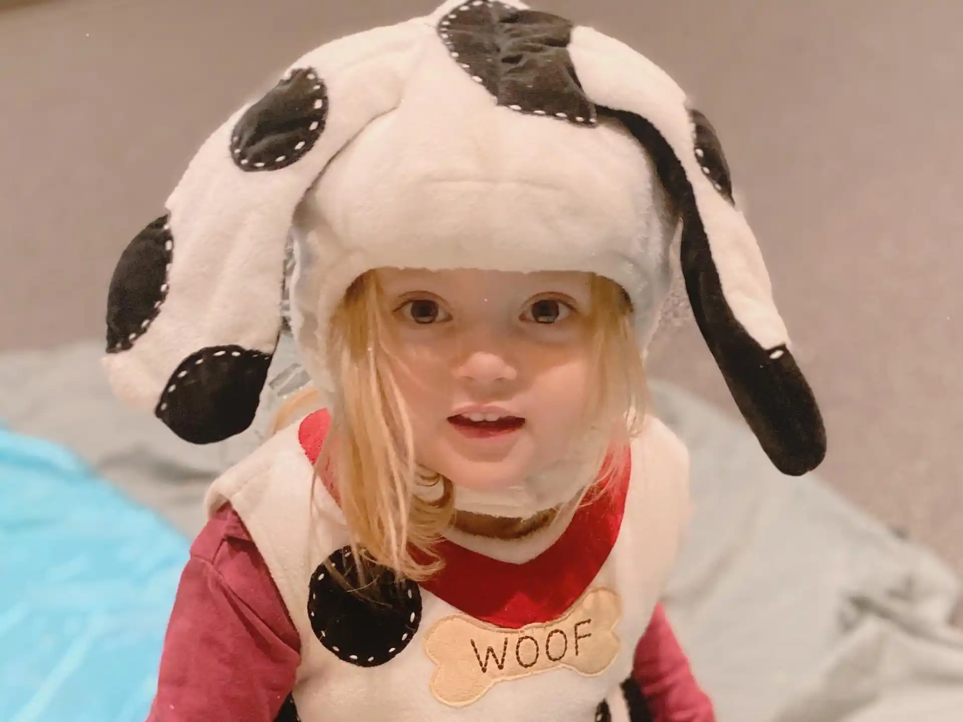 a child wearing a panda hat