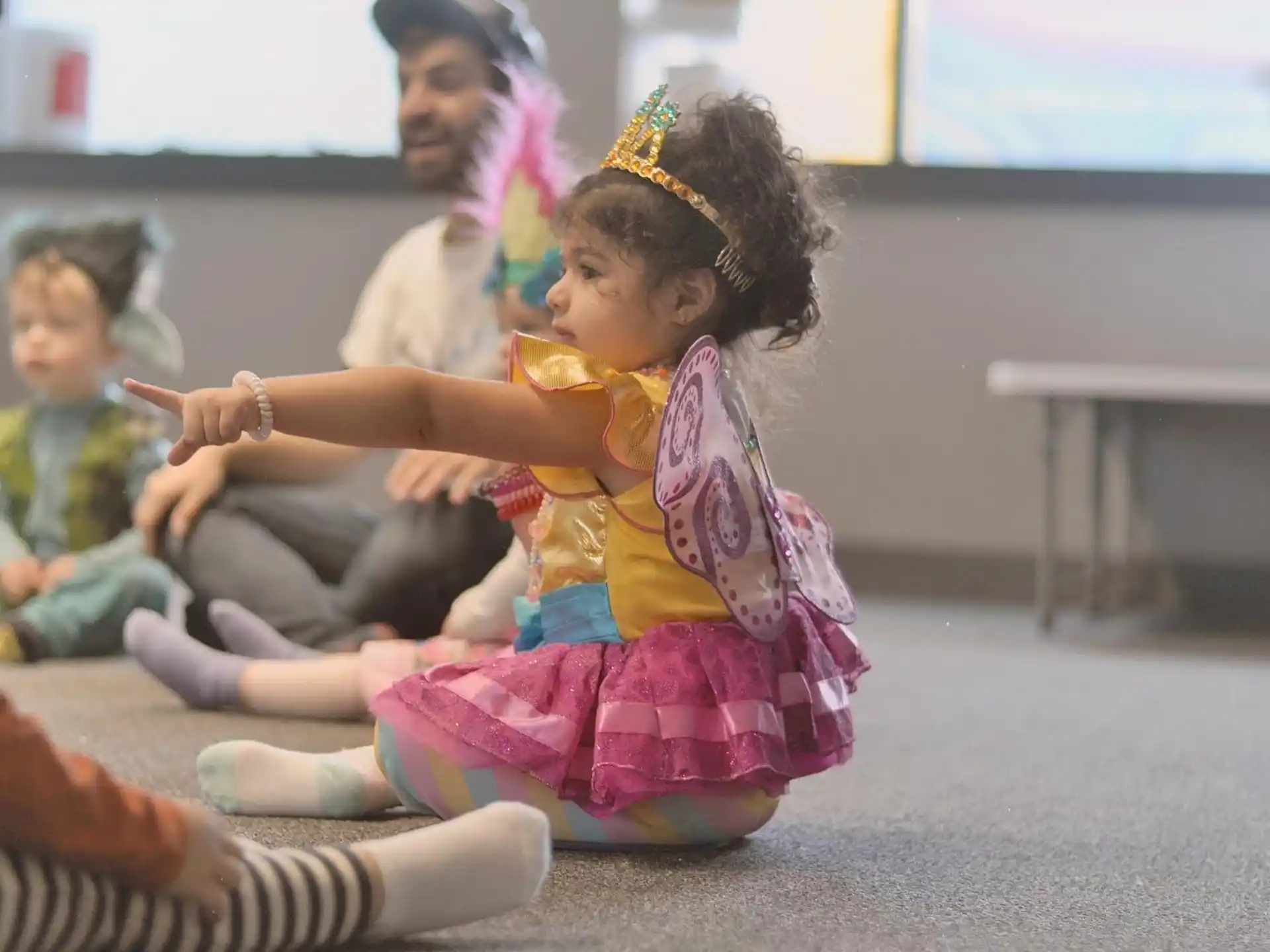 a young girl in a colorful dress
