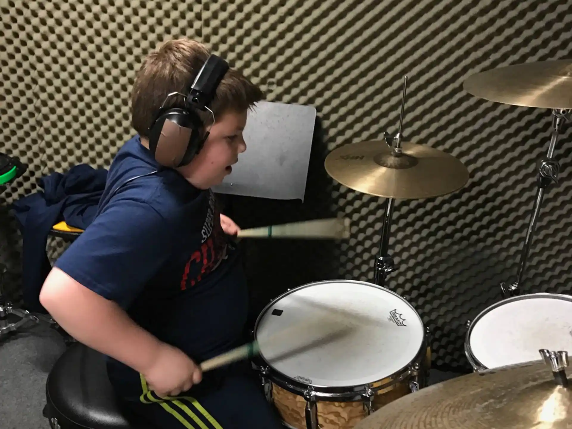 a woman playing drums
