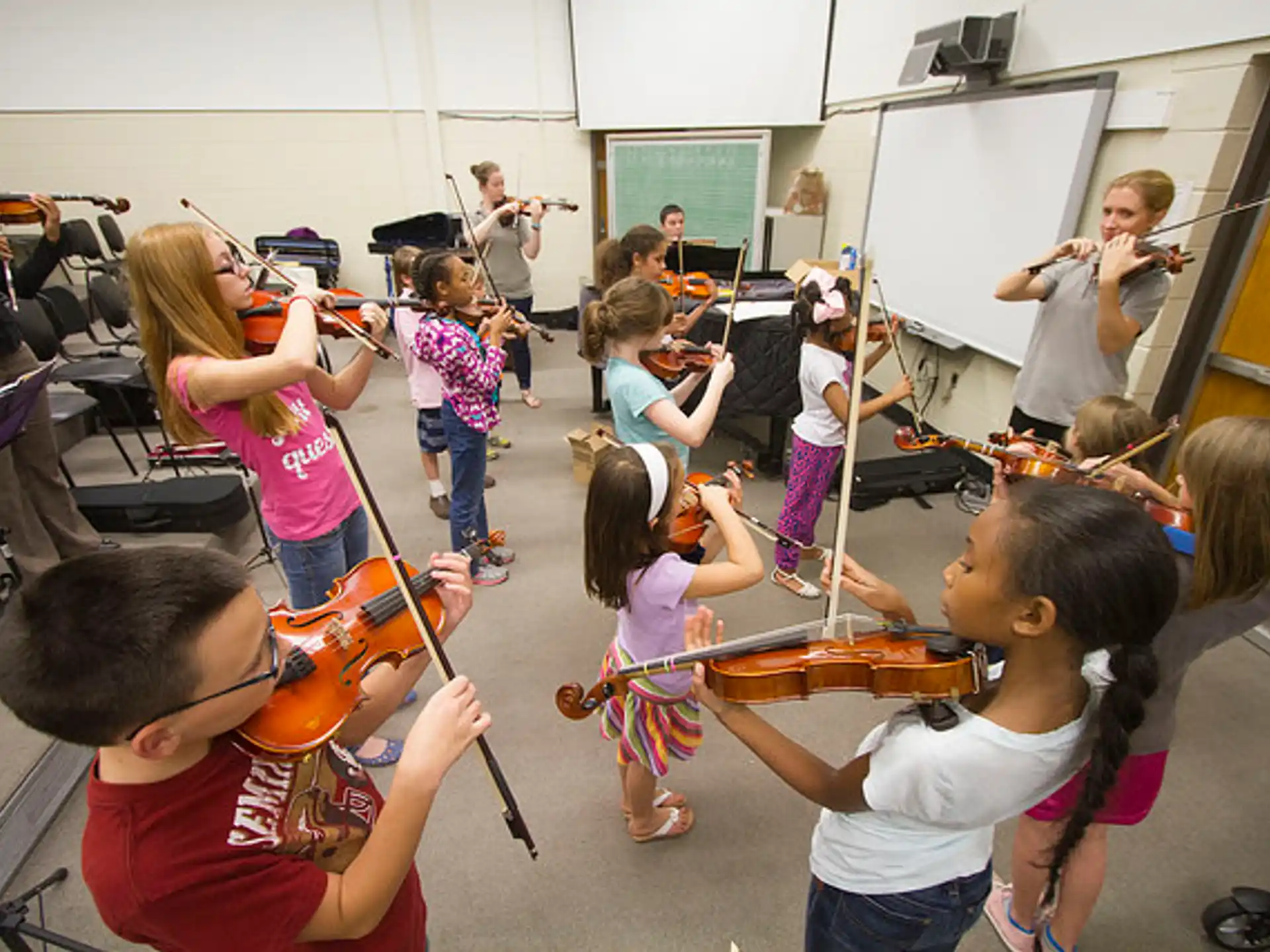 a group of children playing instruments