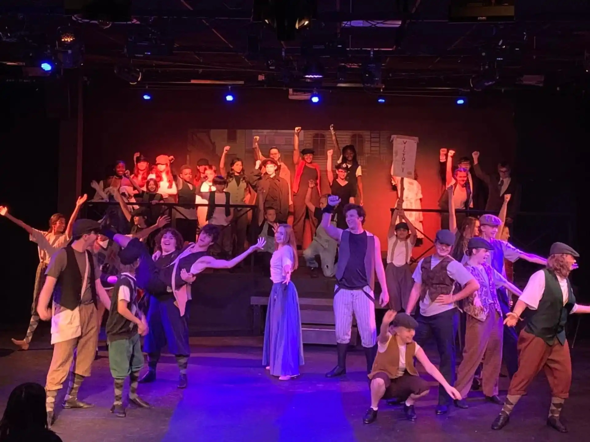 a group of people dancing on a stage