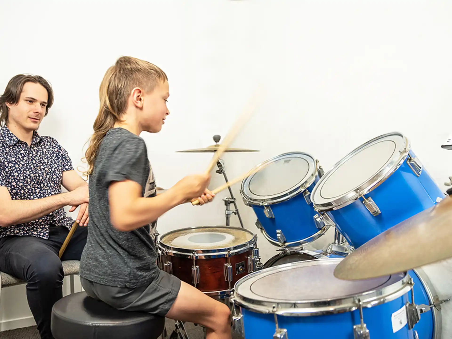 a woman playing drums