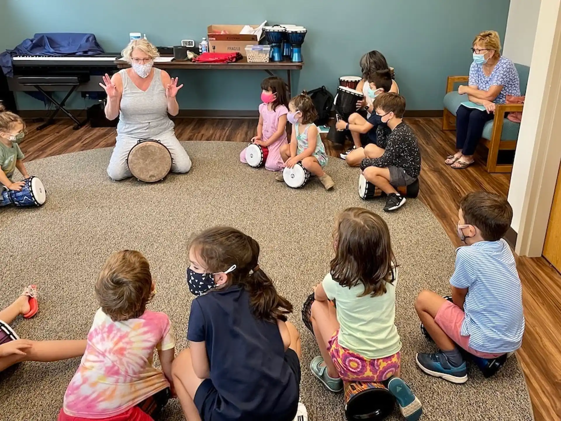 a group of children sitting on the floor