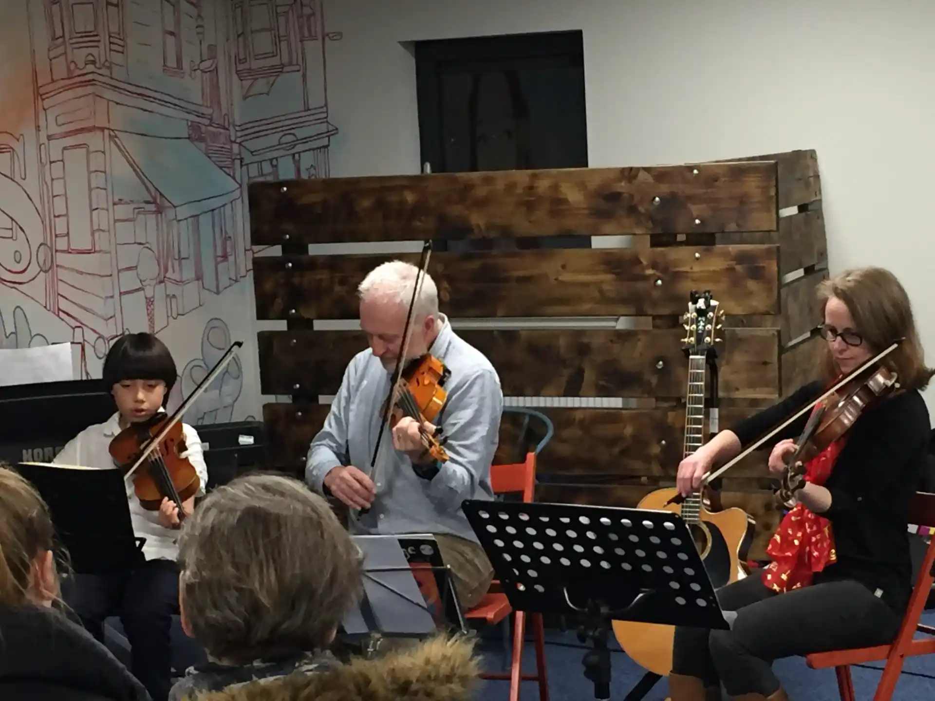 a group of people playing instruments