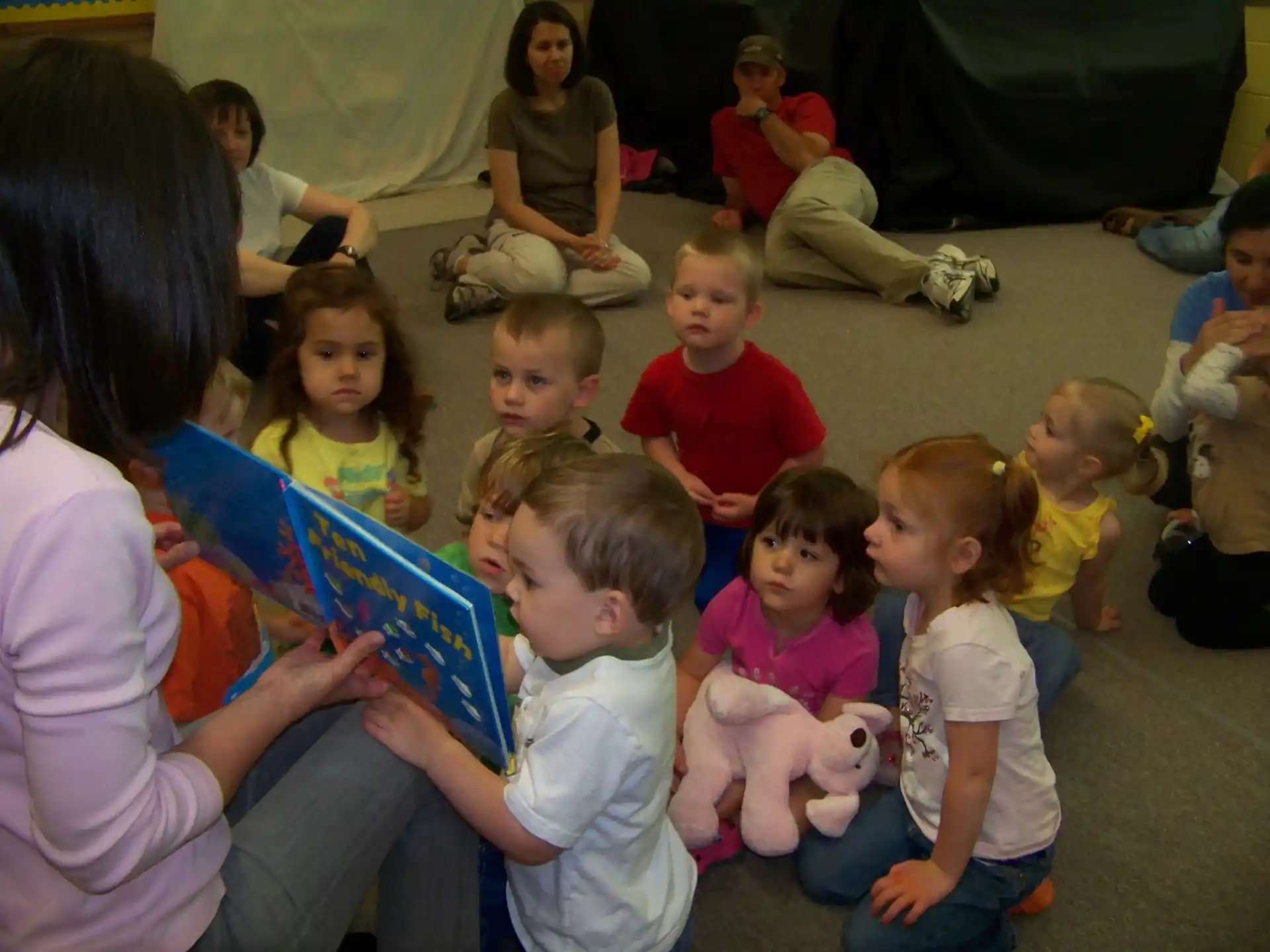 a group of children sitting on the floor