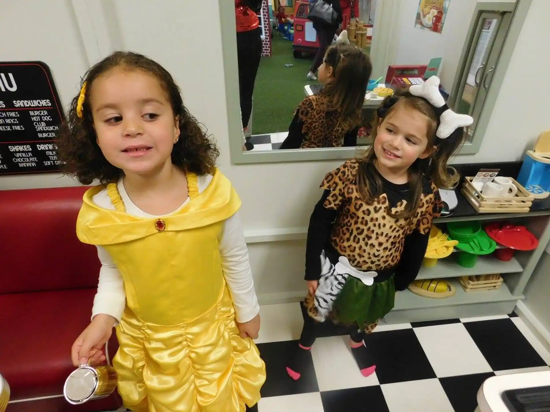a couple of girls posing for the camera