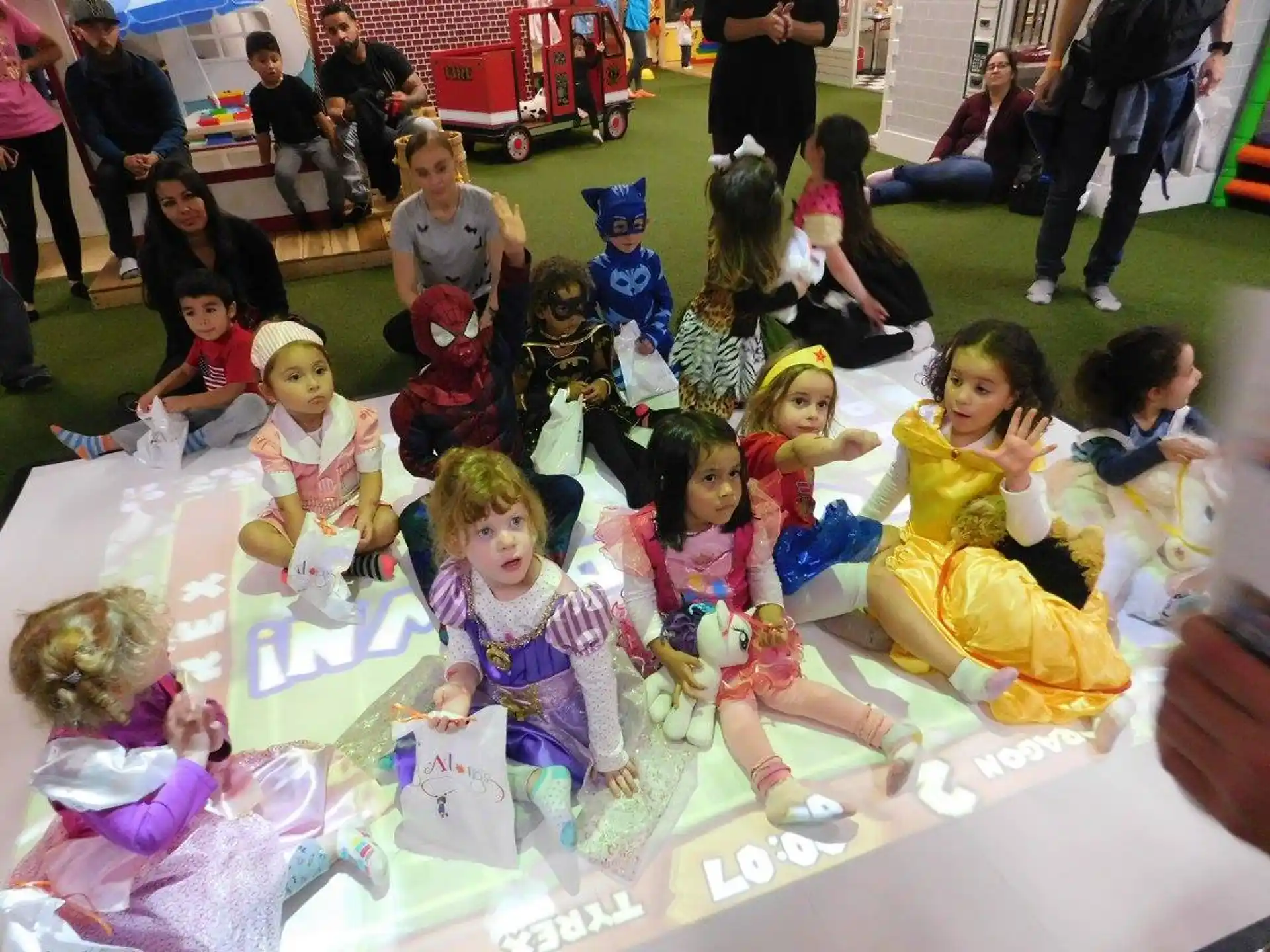 a group of children sitting on the floor