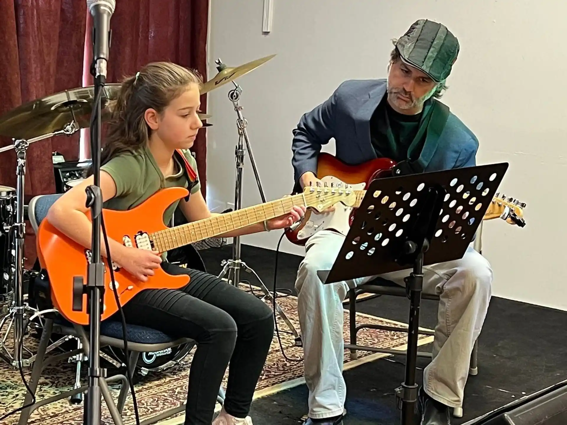 a man and a woman playing instruments