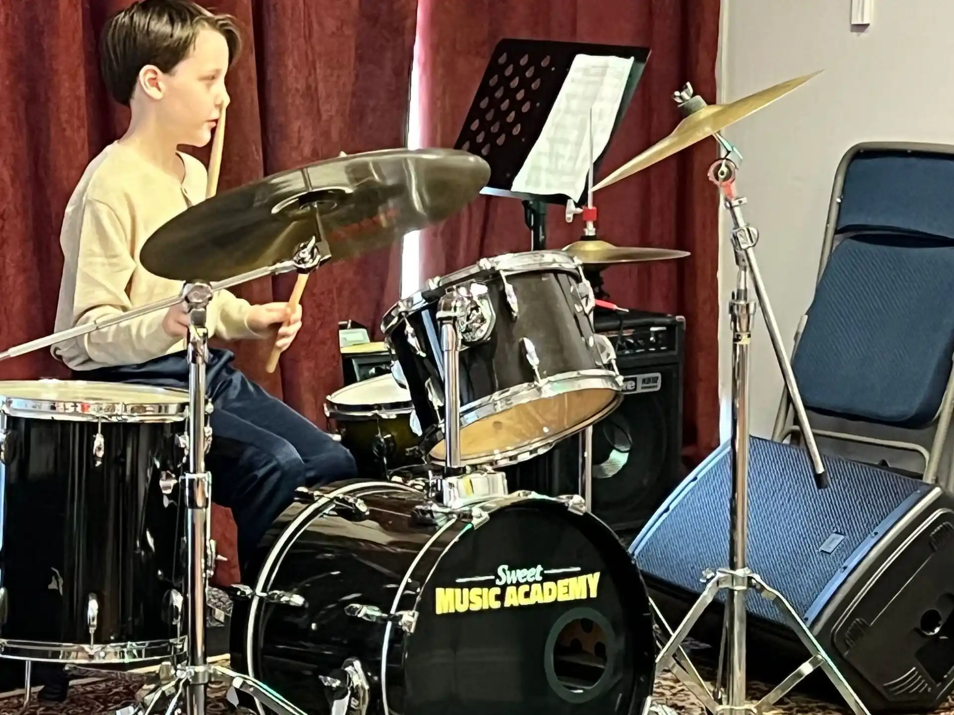 a person playing a guitar and drums