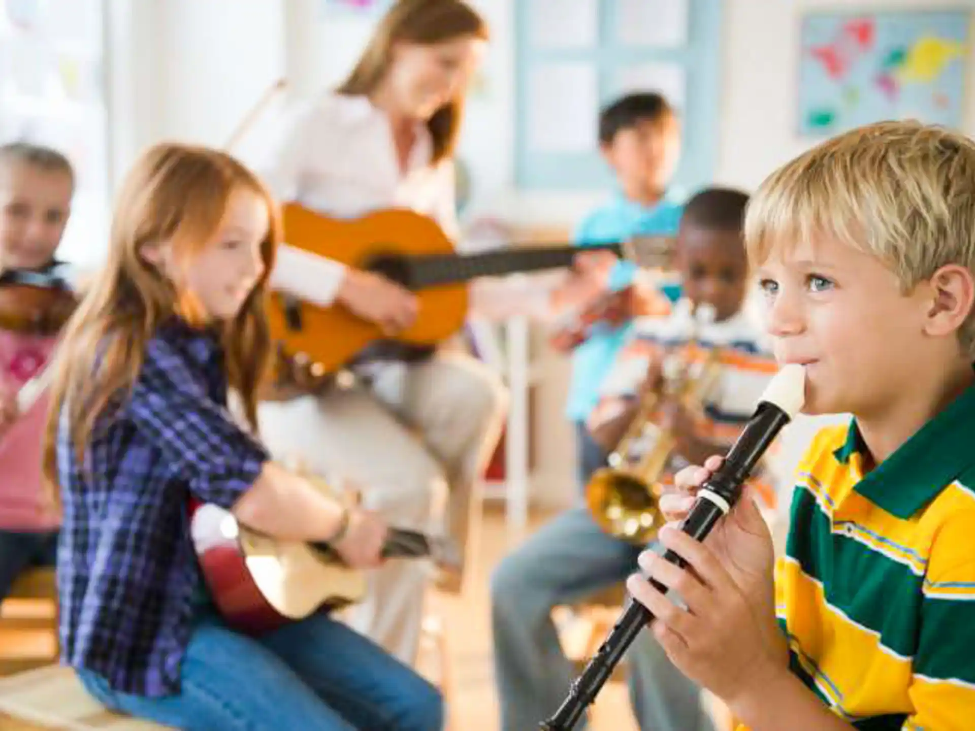 a group of children playing instruments