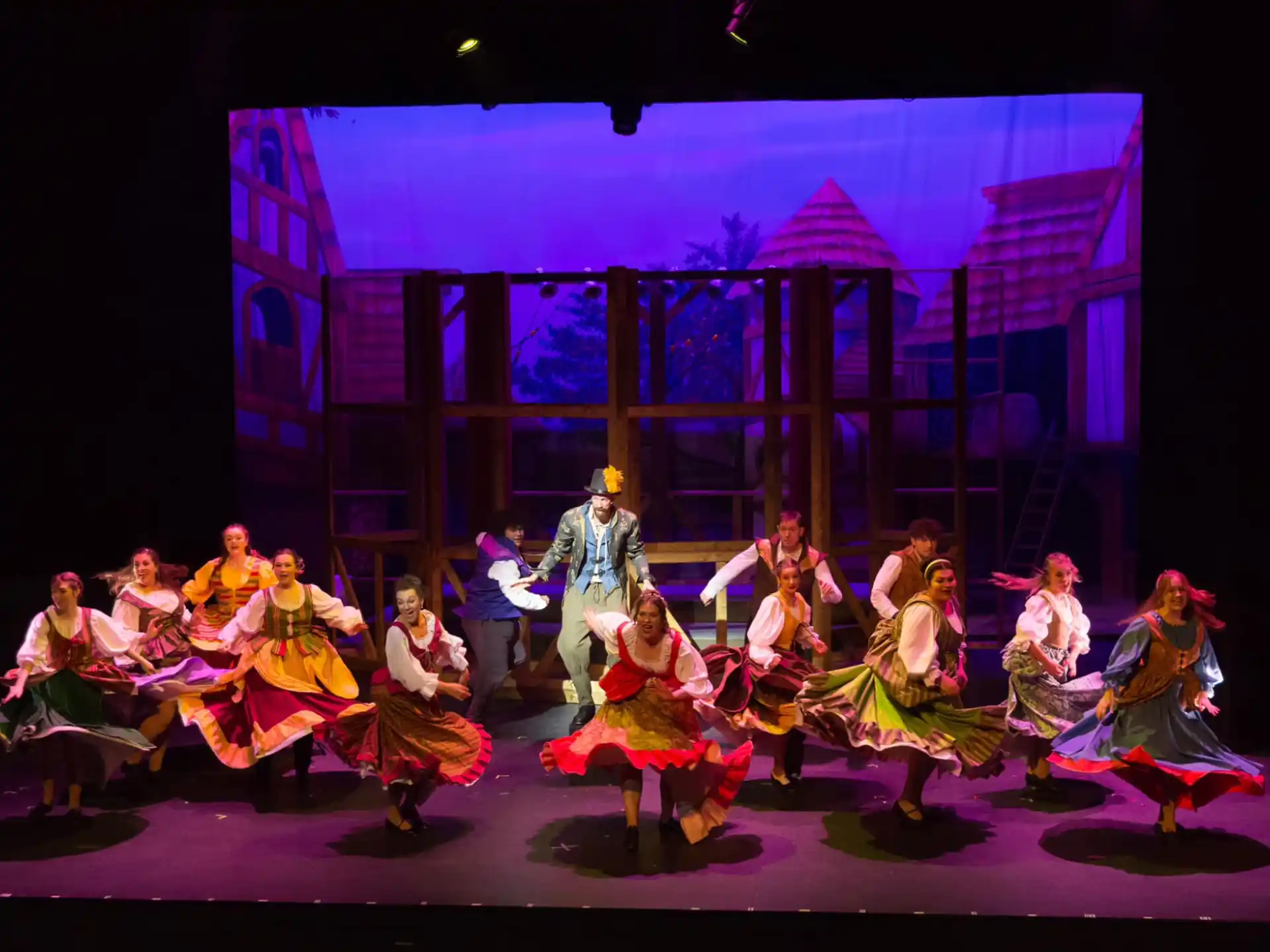 a group of people dancing on a stage