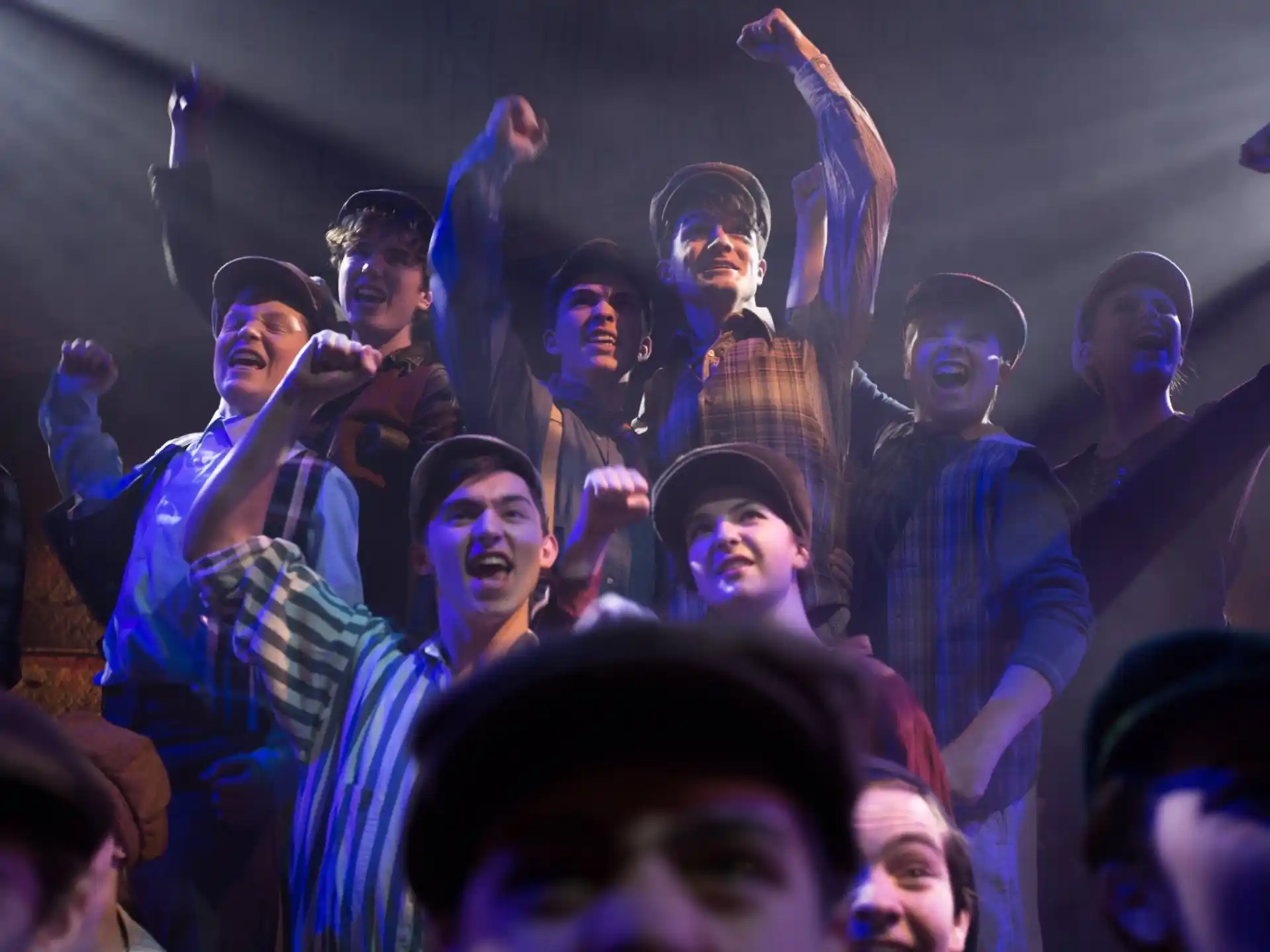 a group of people with their hands up