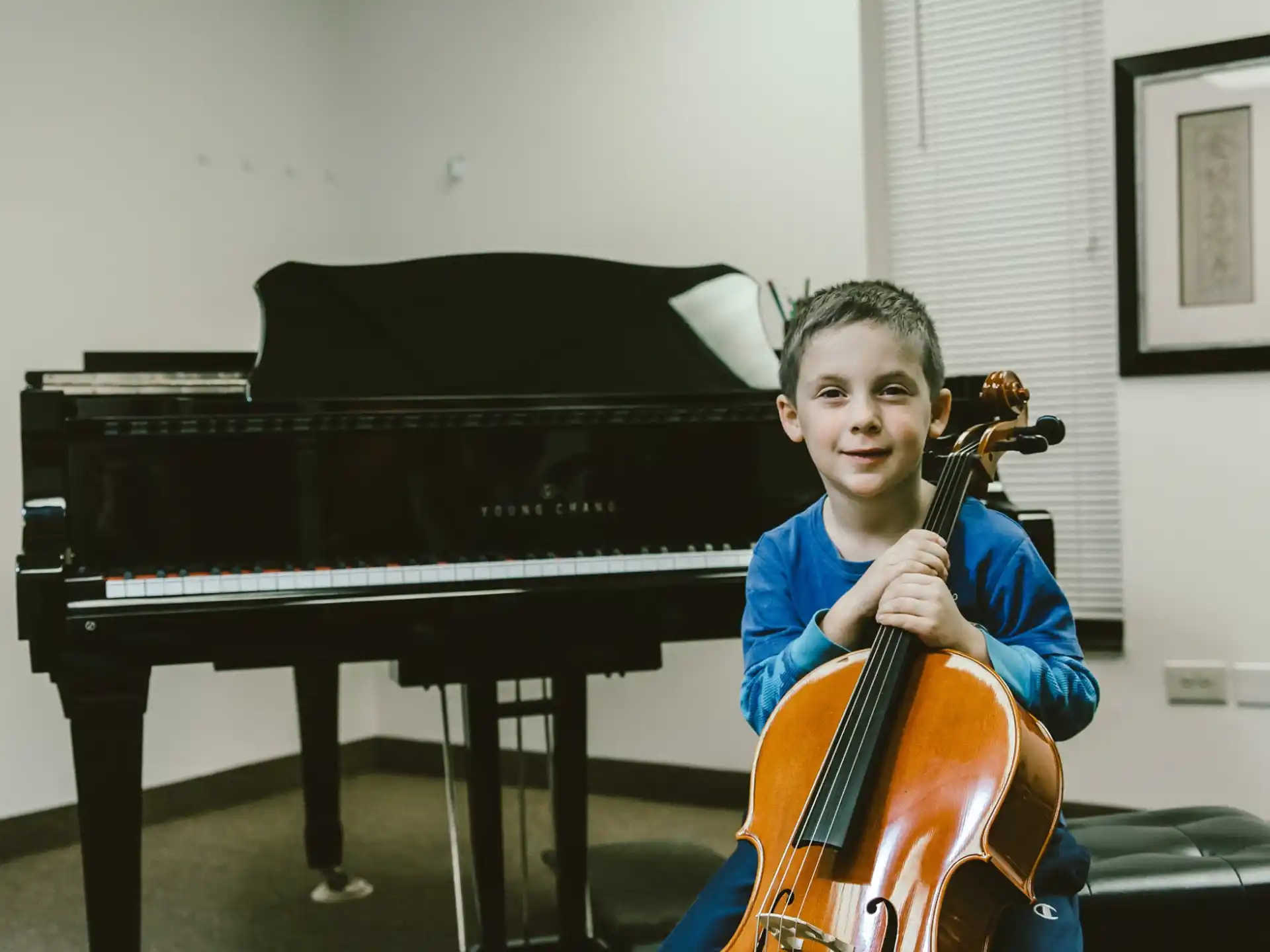 a boy playing a violin