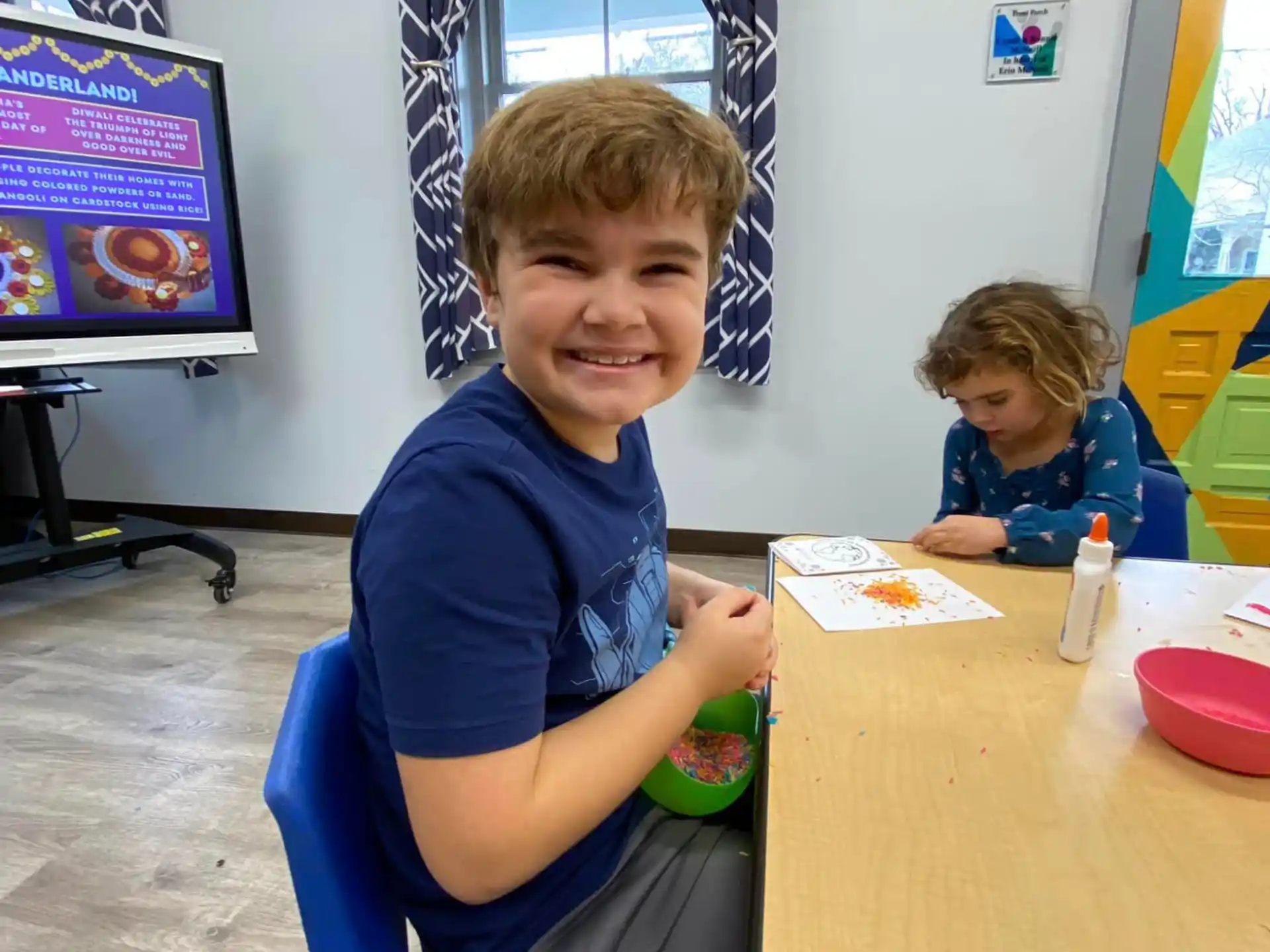 a boy sitting at a table