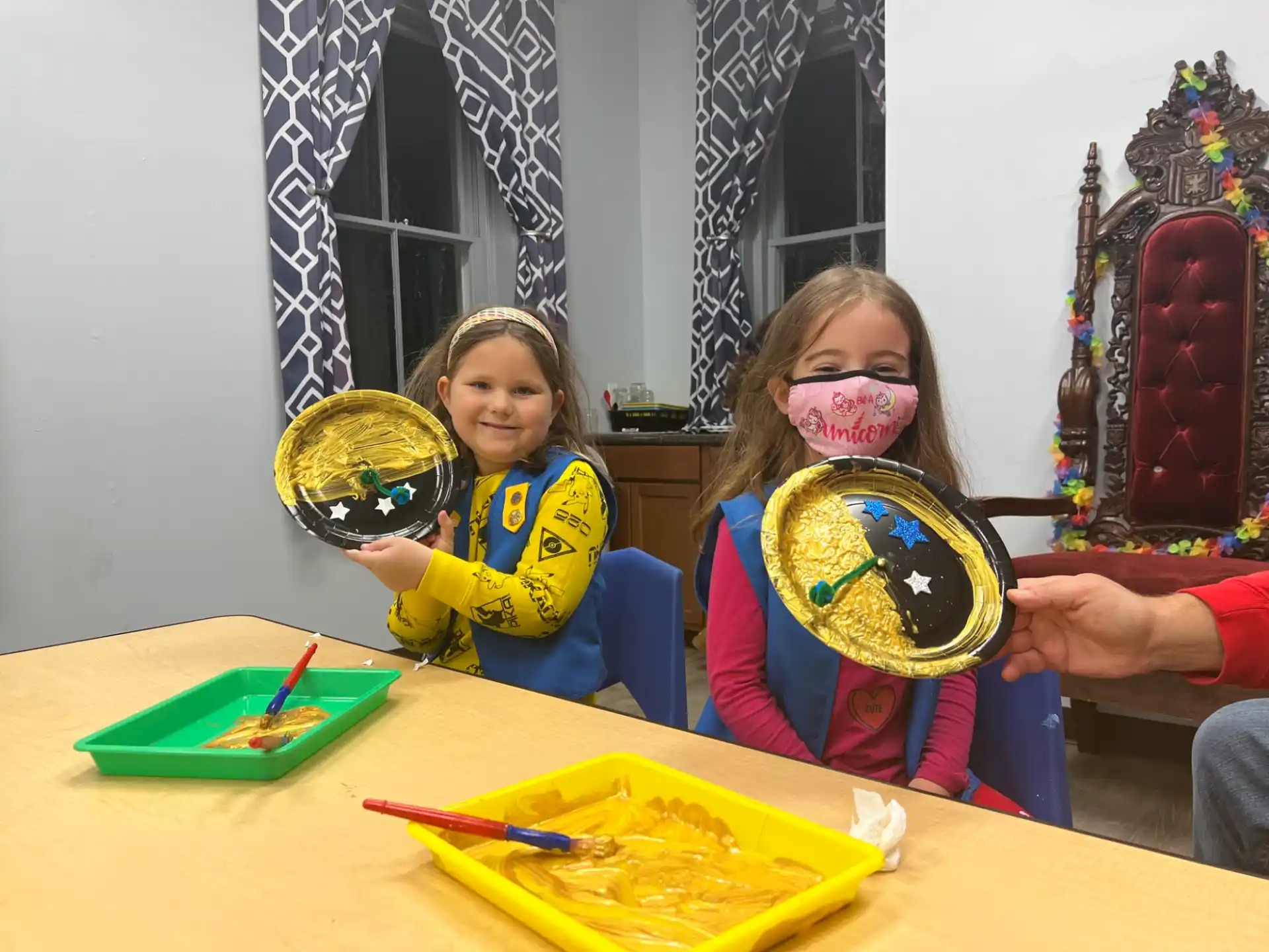 a couple of girls holding round objects
