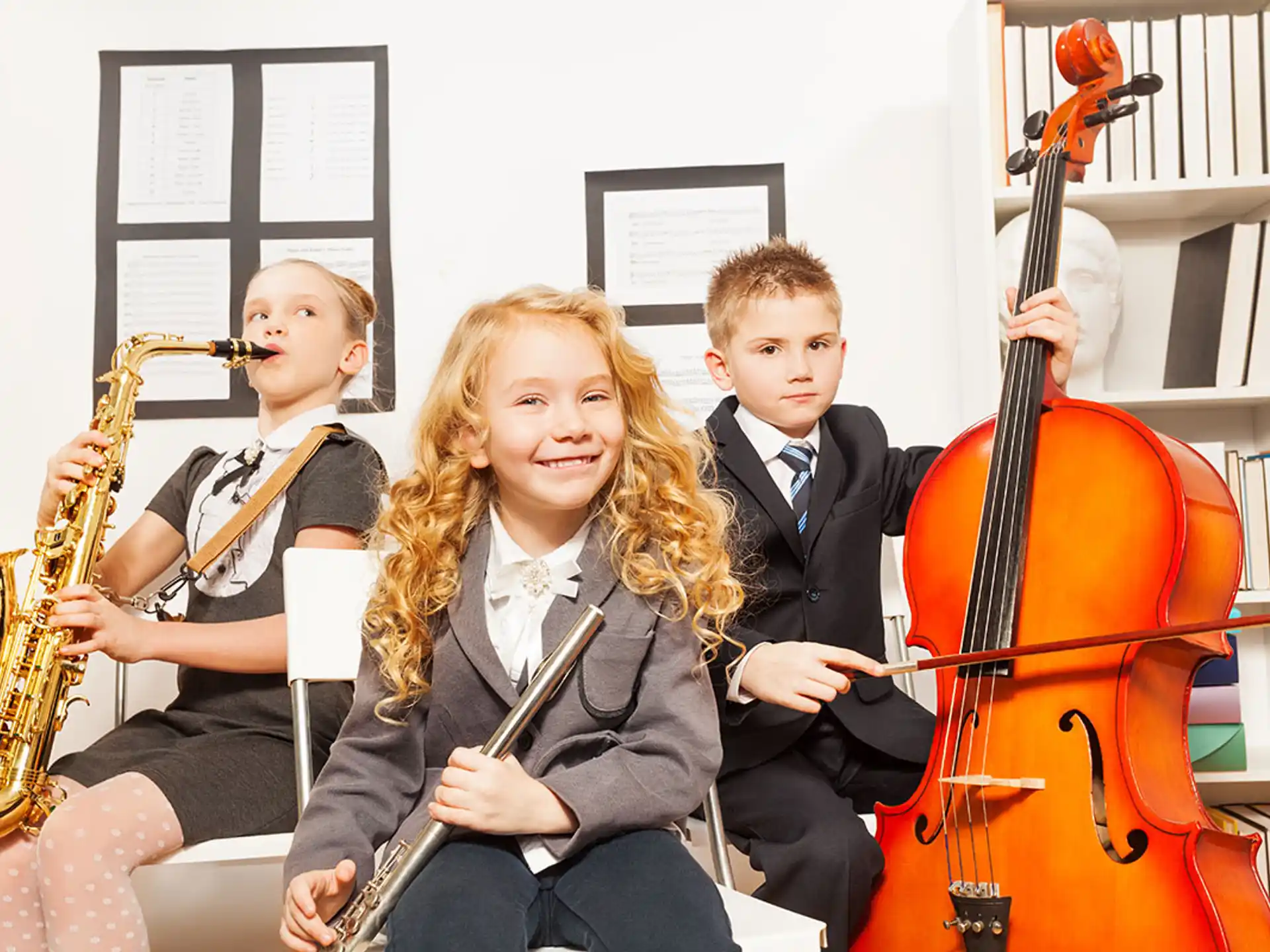 a group of kids playing instruments