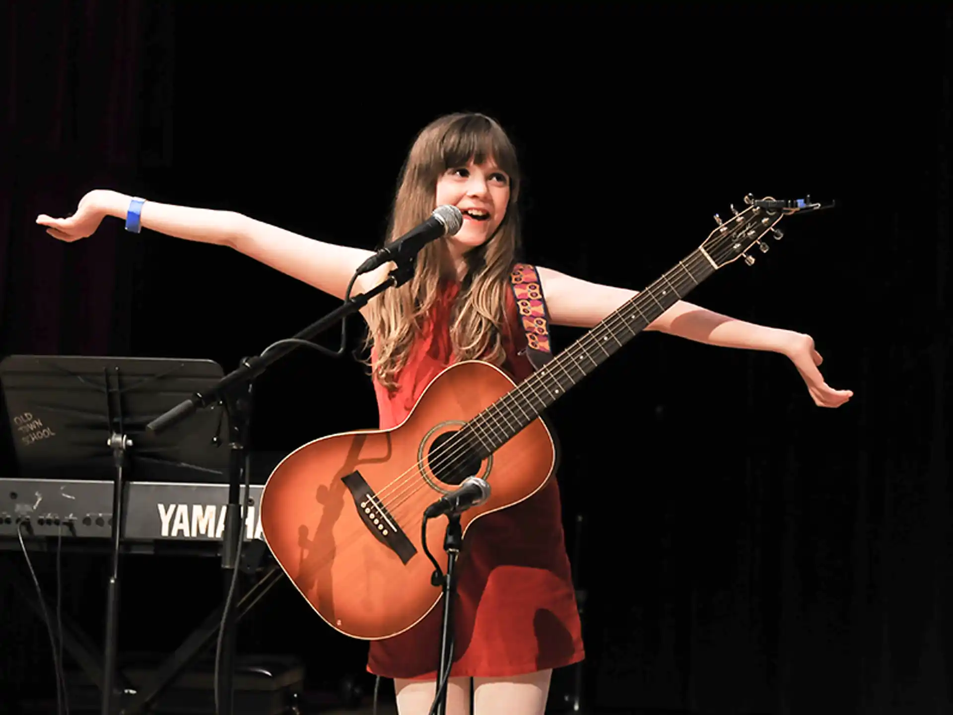 a woman playing a guitar