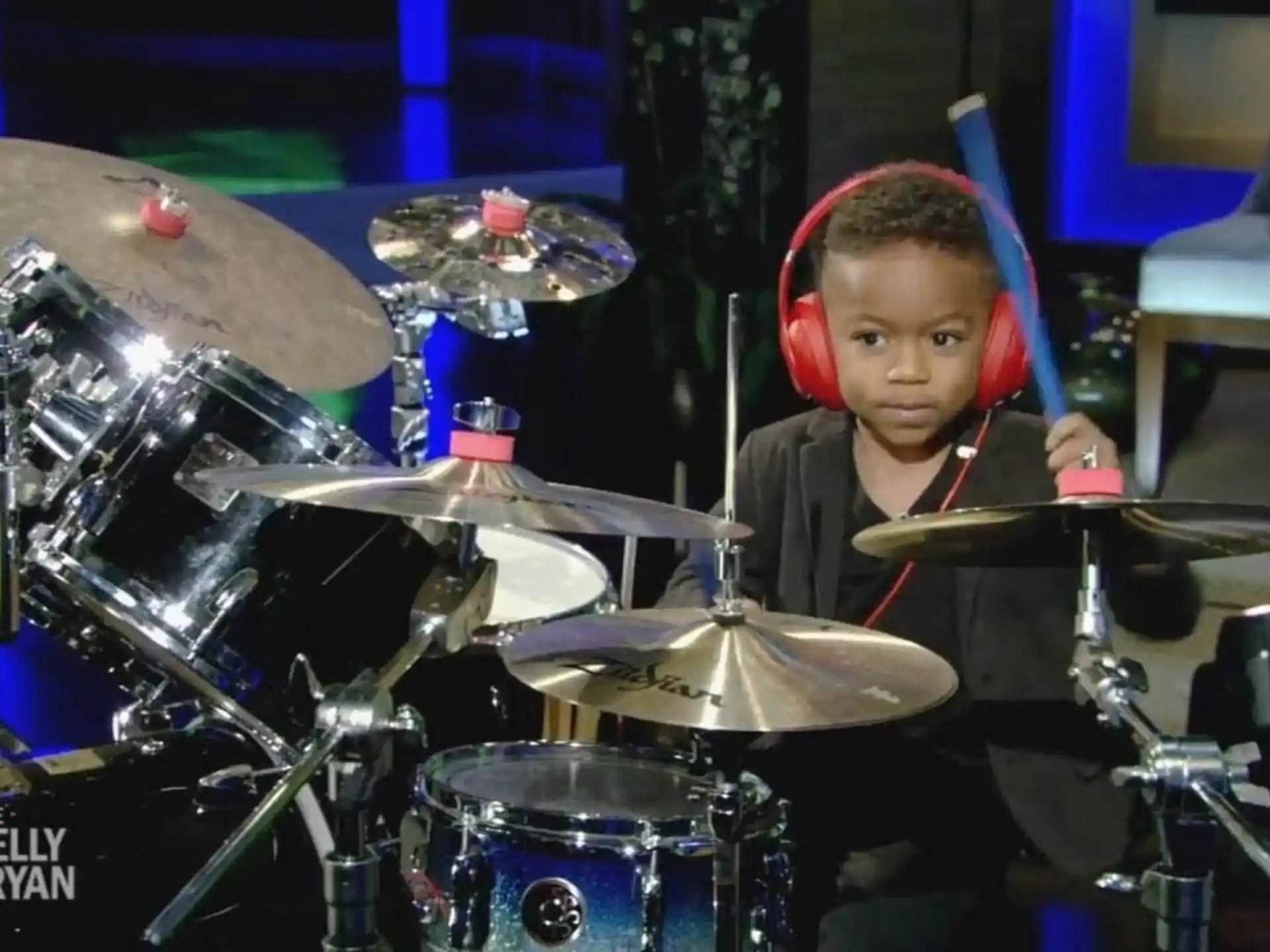 a boy playing drums