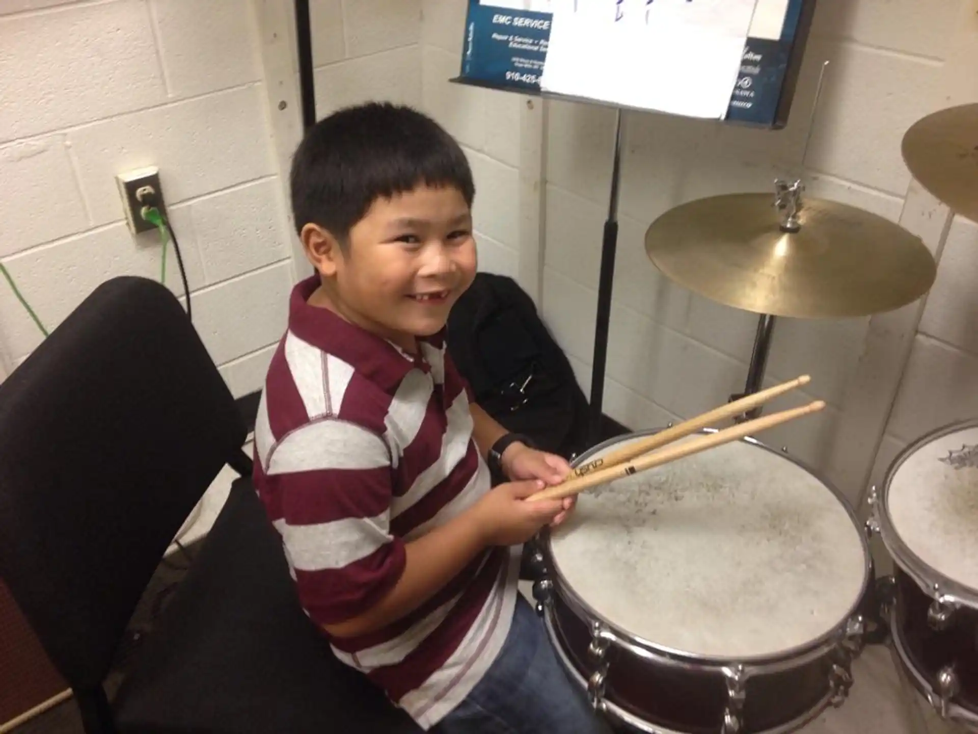 a boy playing drums