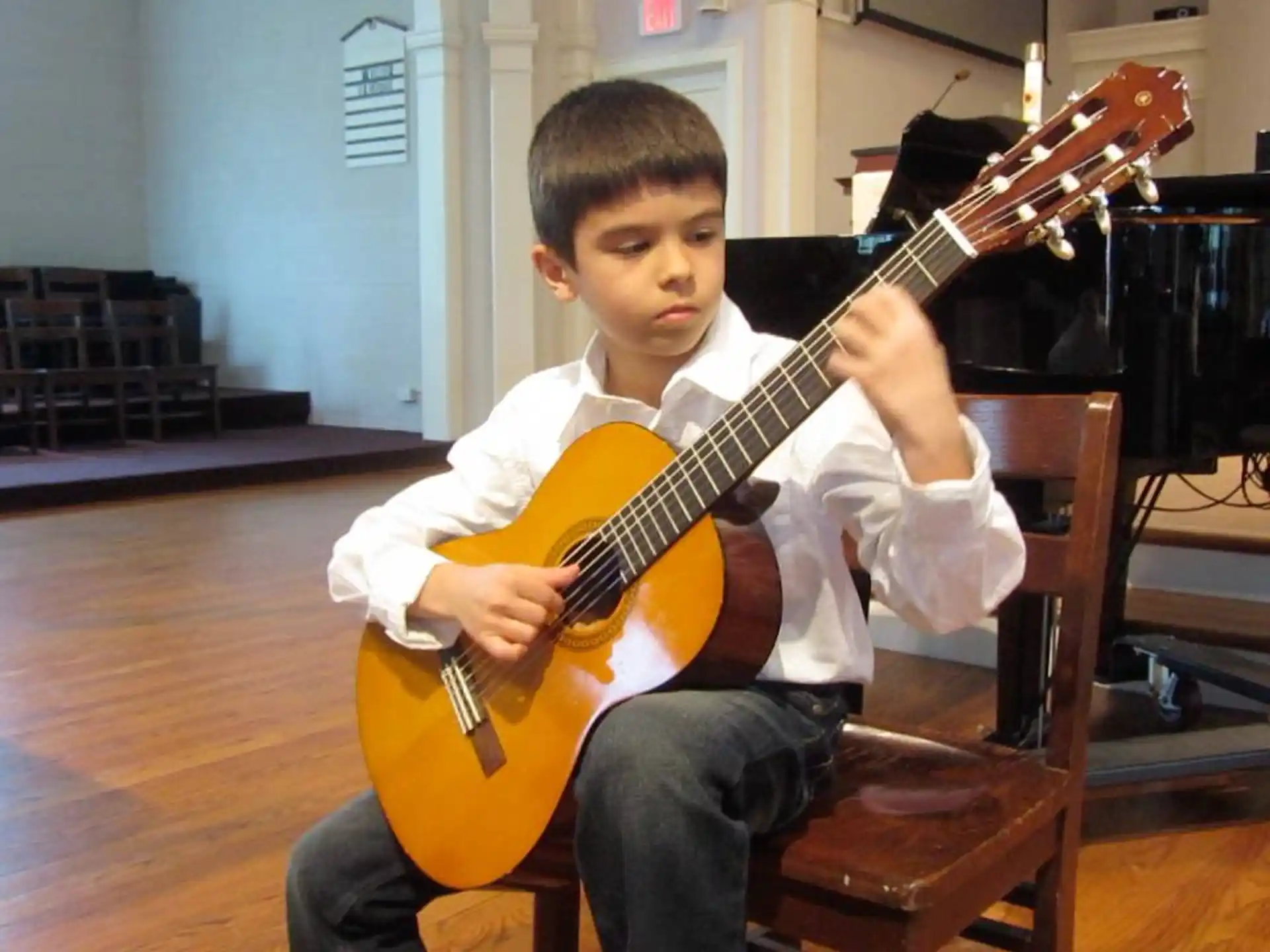 a boy playing a guitar